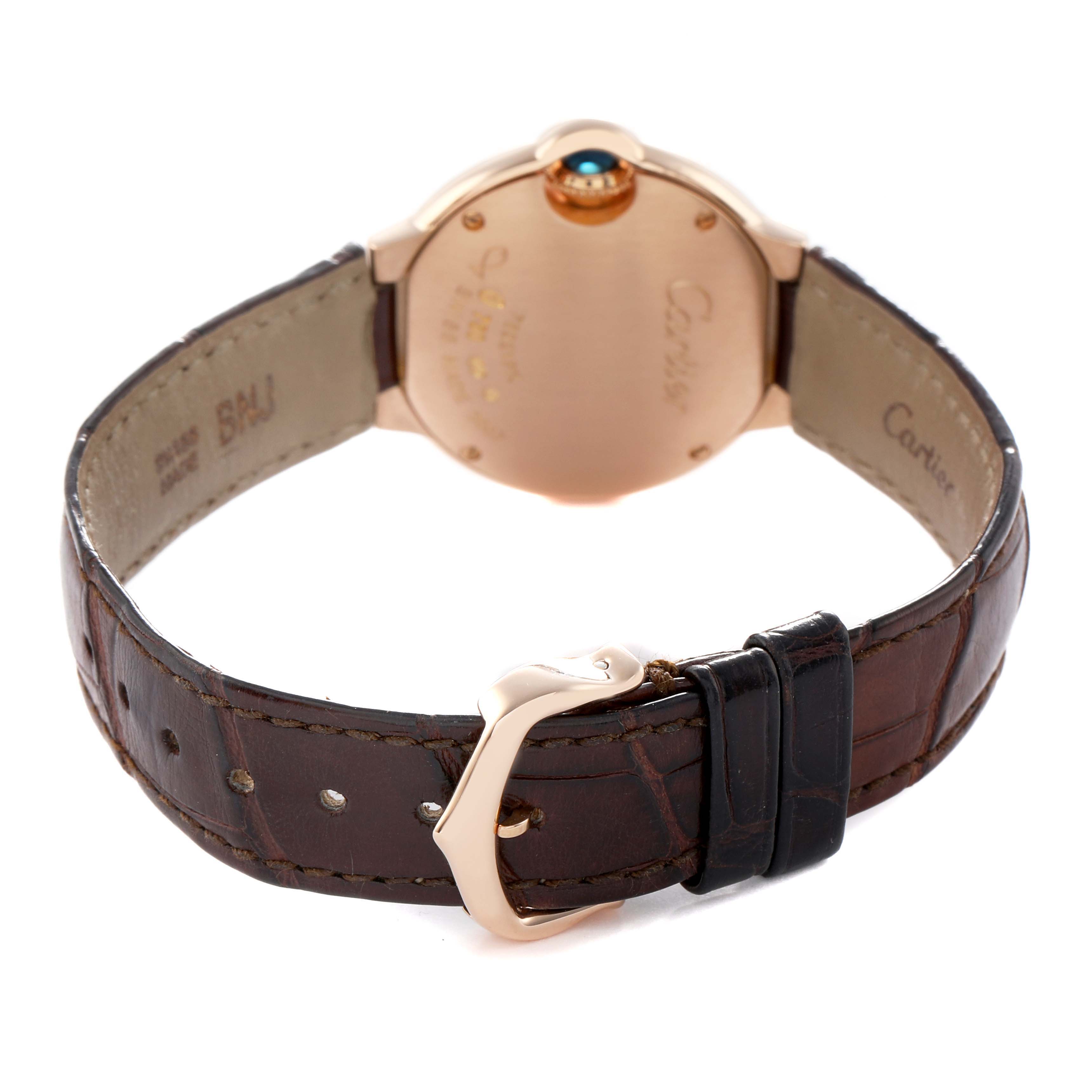 This image shows the back of a Cartier Ballon Bleu W6900256 Women's Rose Gold Silver Dial watch, highlighting the clasp, leather strap, and case back.