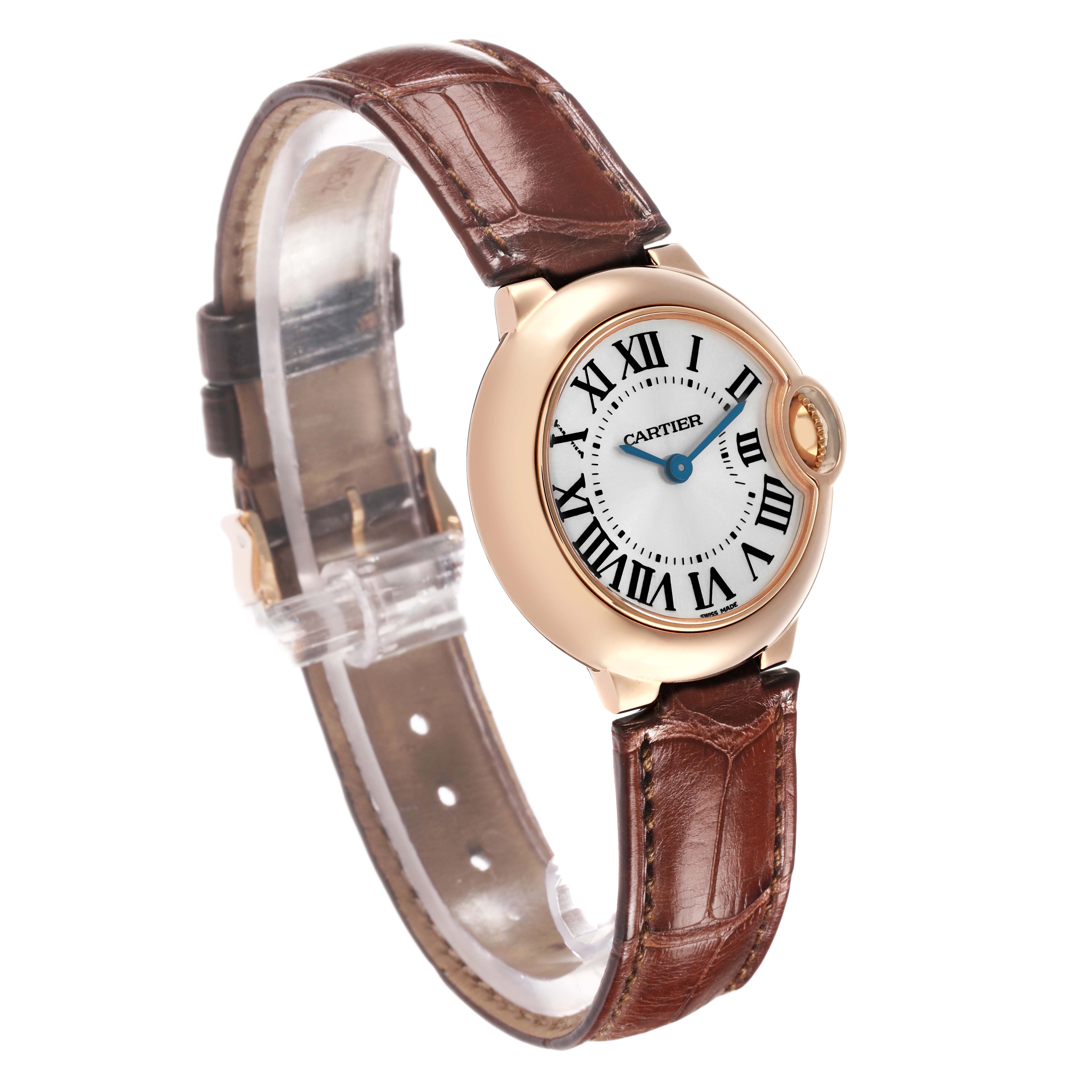 The Cartier Ballon Bleu W6900256 Women's Rose Gold Silver Dial watch is shown at an angle displaying the face, Roman numerals, and the leather strap.
