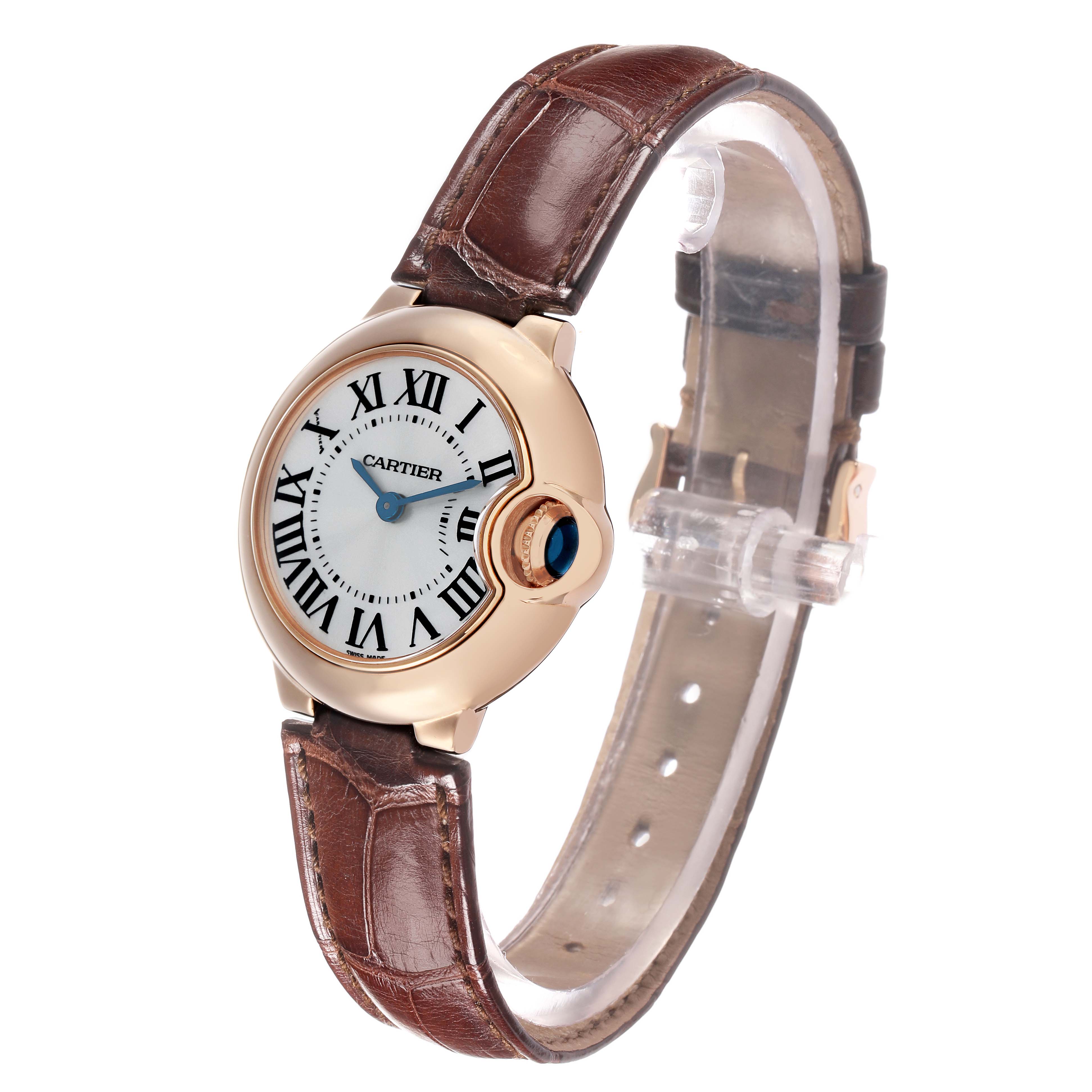 The Cartier Ballon Bleu W6900256 Women's Rose Gold Silver Dial watch is shown at a slight angle, highlighting the dial, crown, and brown leather strap.