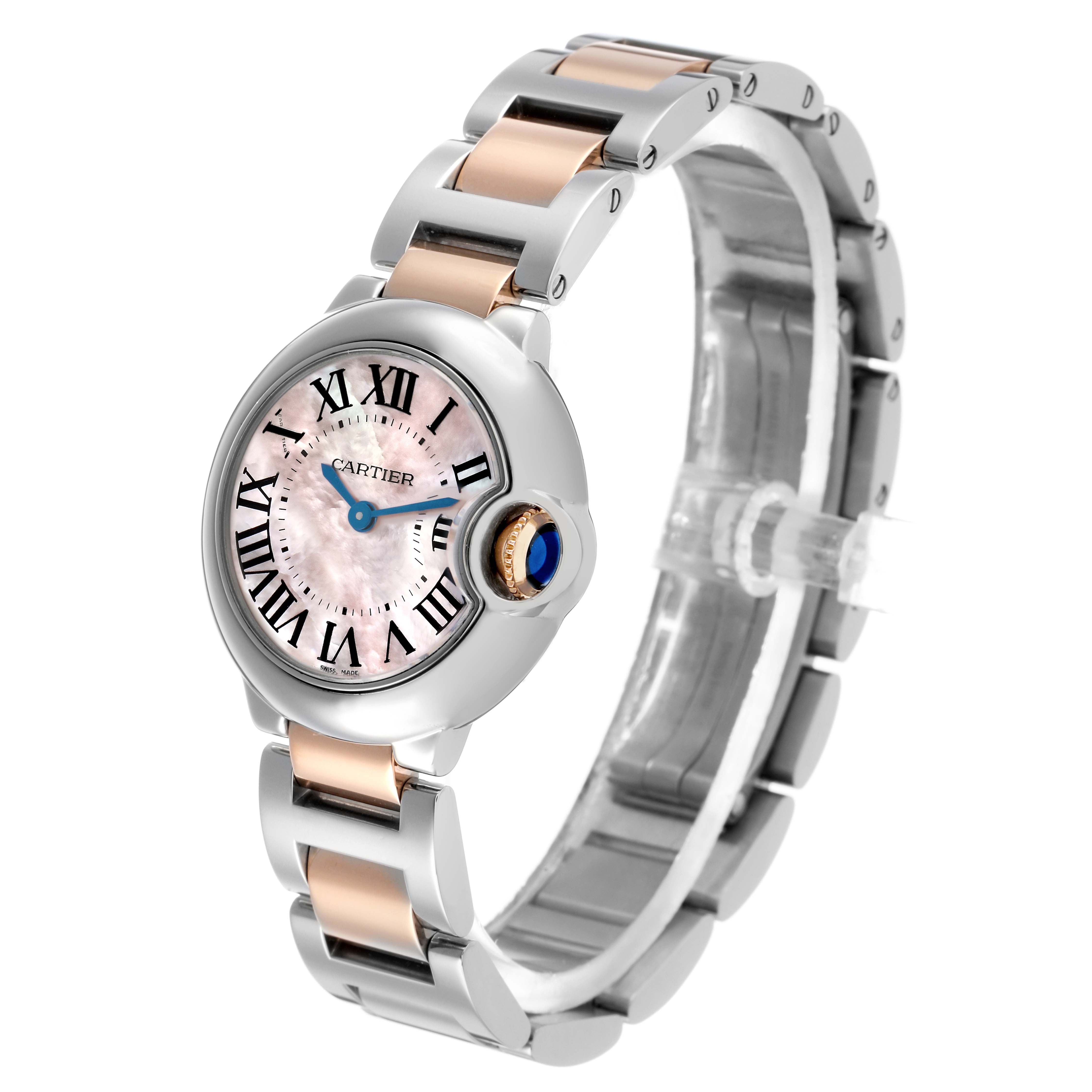 The Cartier Ballon Bleu W6920034 Women's Steel and Gold (two tone) Mother of Pearl Dial watch is shown at a three-quarter angle, highlighting its face, crown, and two-tone bracelet.