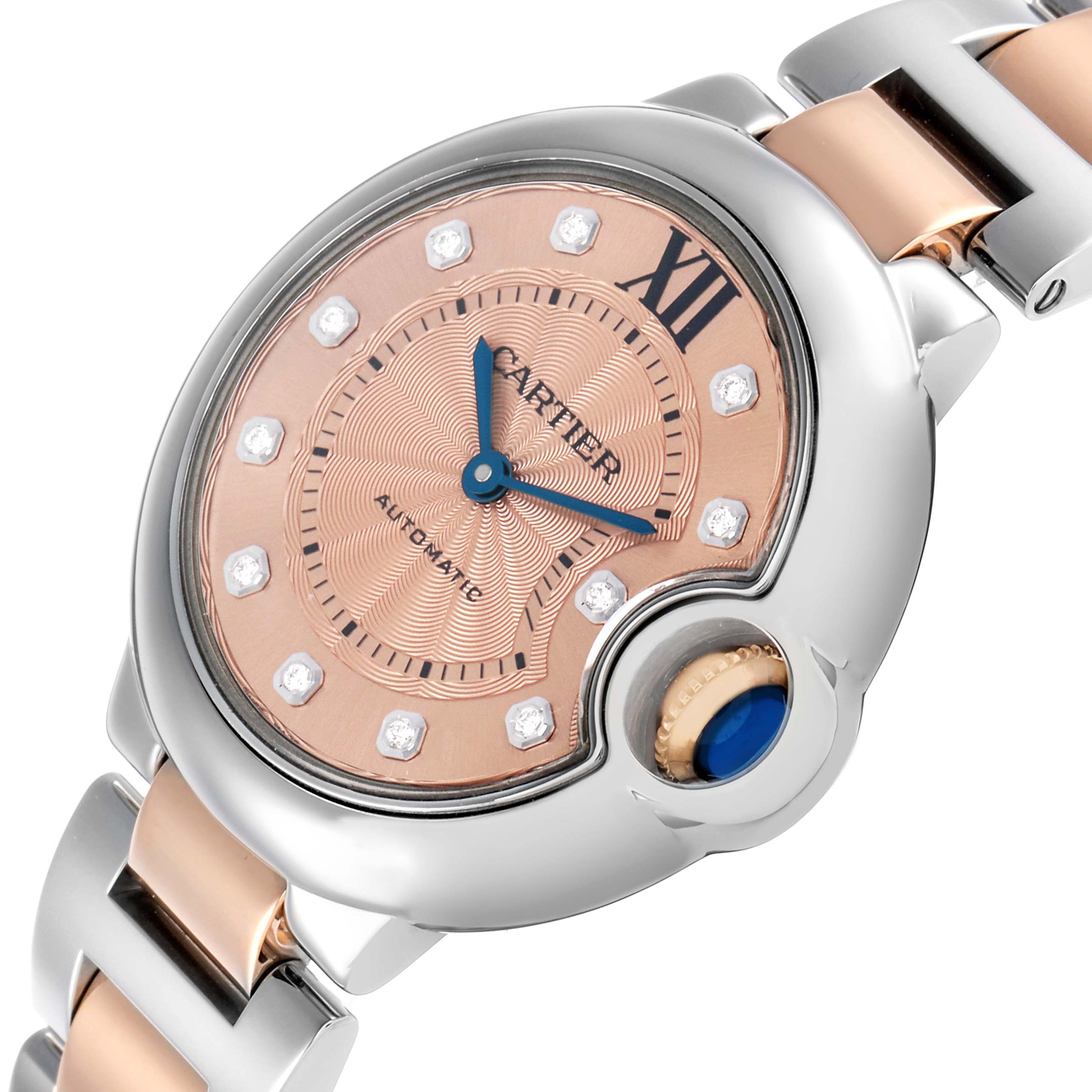 The Cartier Ballon Bleu WE902053 Women's Steel and Gold (two tone) Pink Dial watch is shown at a slight angle, highlighting the face, crown, and part of the bracelet.