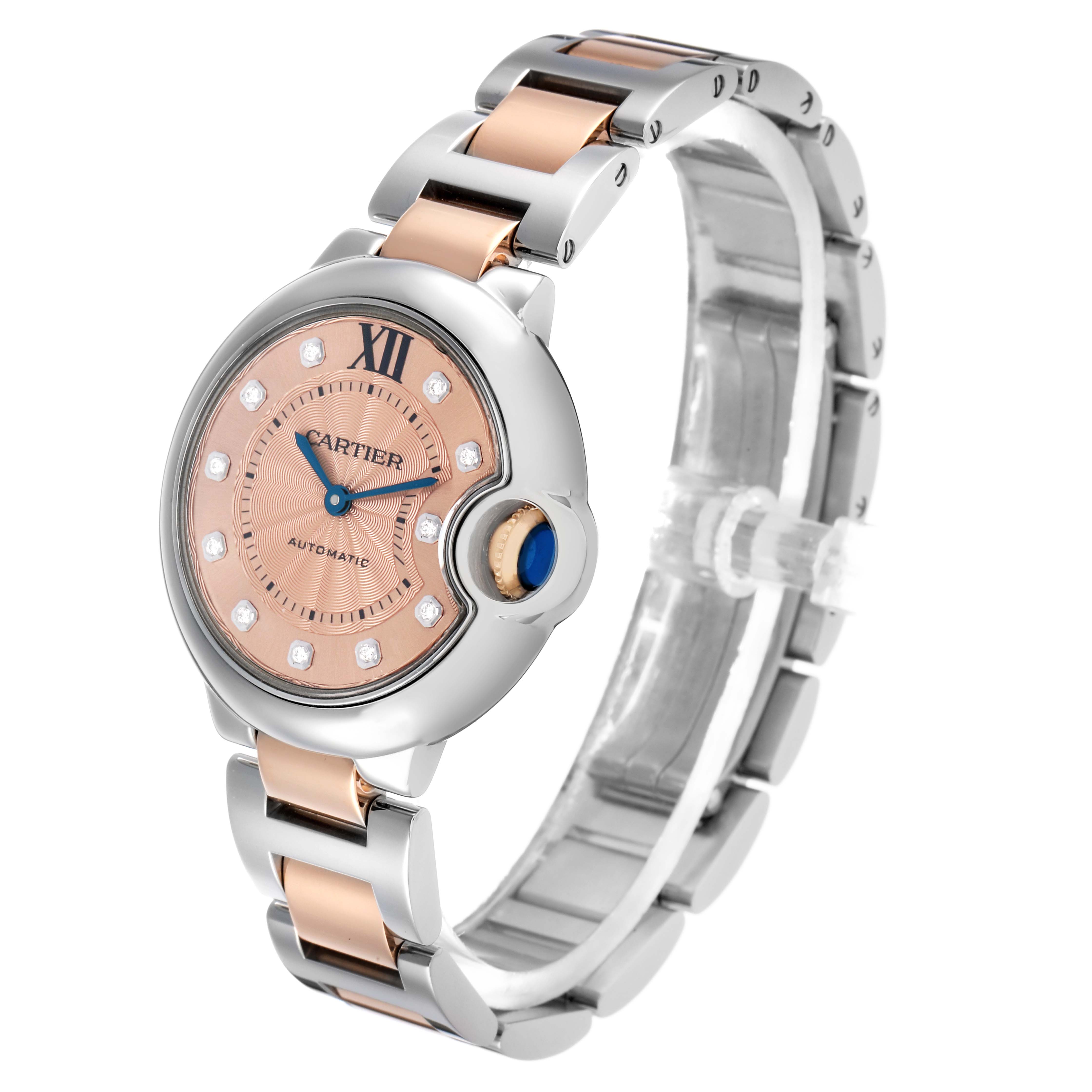 The Cartier Ballon Bleu WE902053 Women's Steel and Gold (two tone) Pink Dial watch is shown at an angled side view, highlighting the face, bezel, and two-tone bracelet.