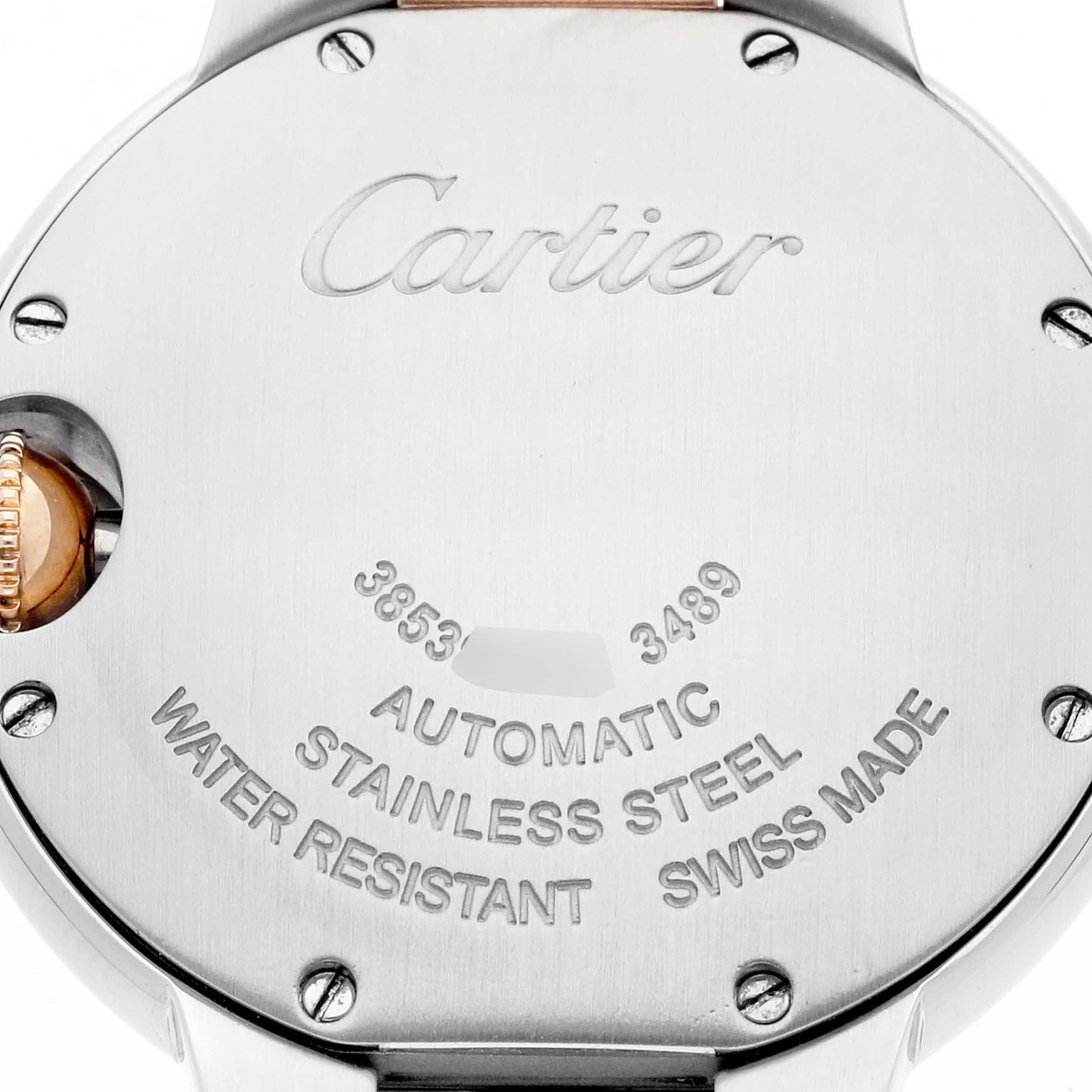The image shows the back of a Cartier Ballon Bleu WE902053 Women's Steel and Gold (two tone) Pink Dial watch, featuring inscriptions and a stainless steel finish.