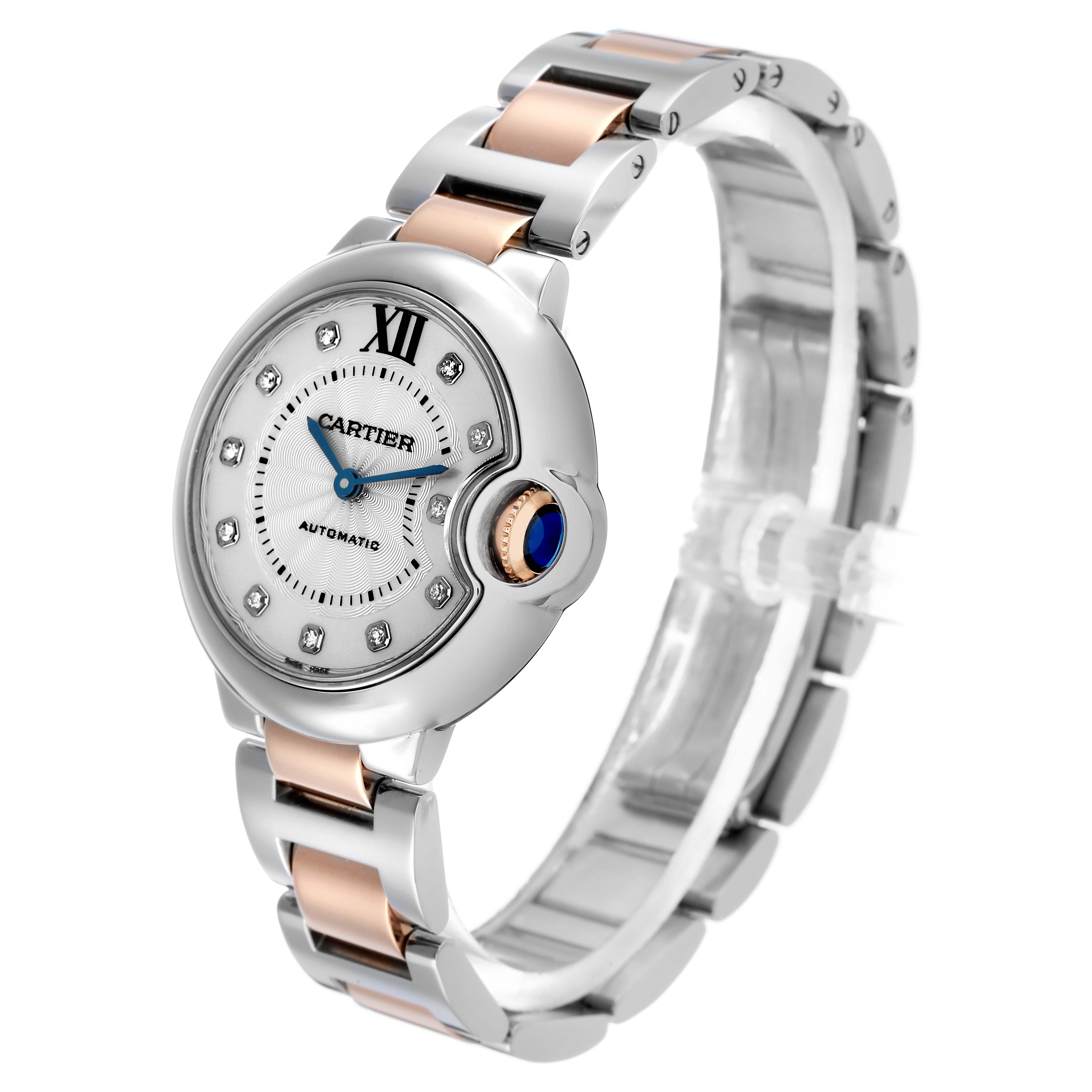 The Cartier Ballon Bleu WE902044 Women's Steel and Gold (two tone) Silver Dial watch is shown from a three-quarter angle, featuring the dial, crown, and bracelet links.