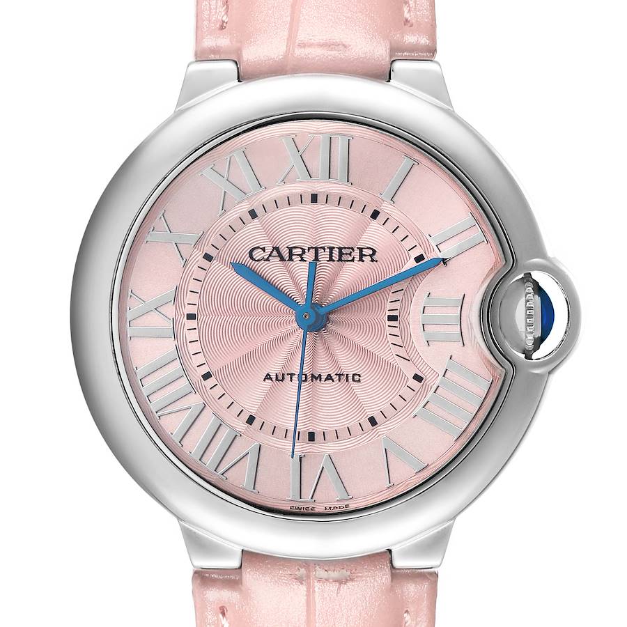 The Cartier Ballon Bleu WSBB0007 Women's Stainless Steel Pink Dial watch is shown from the front, highlighting its pink dial, blue hands, and round case with a distinctive crown.