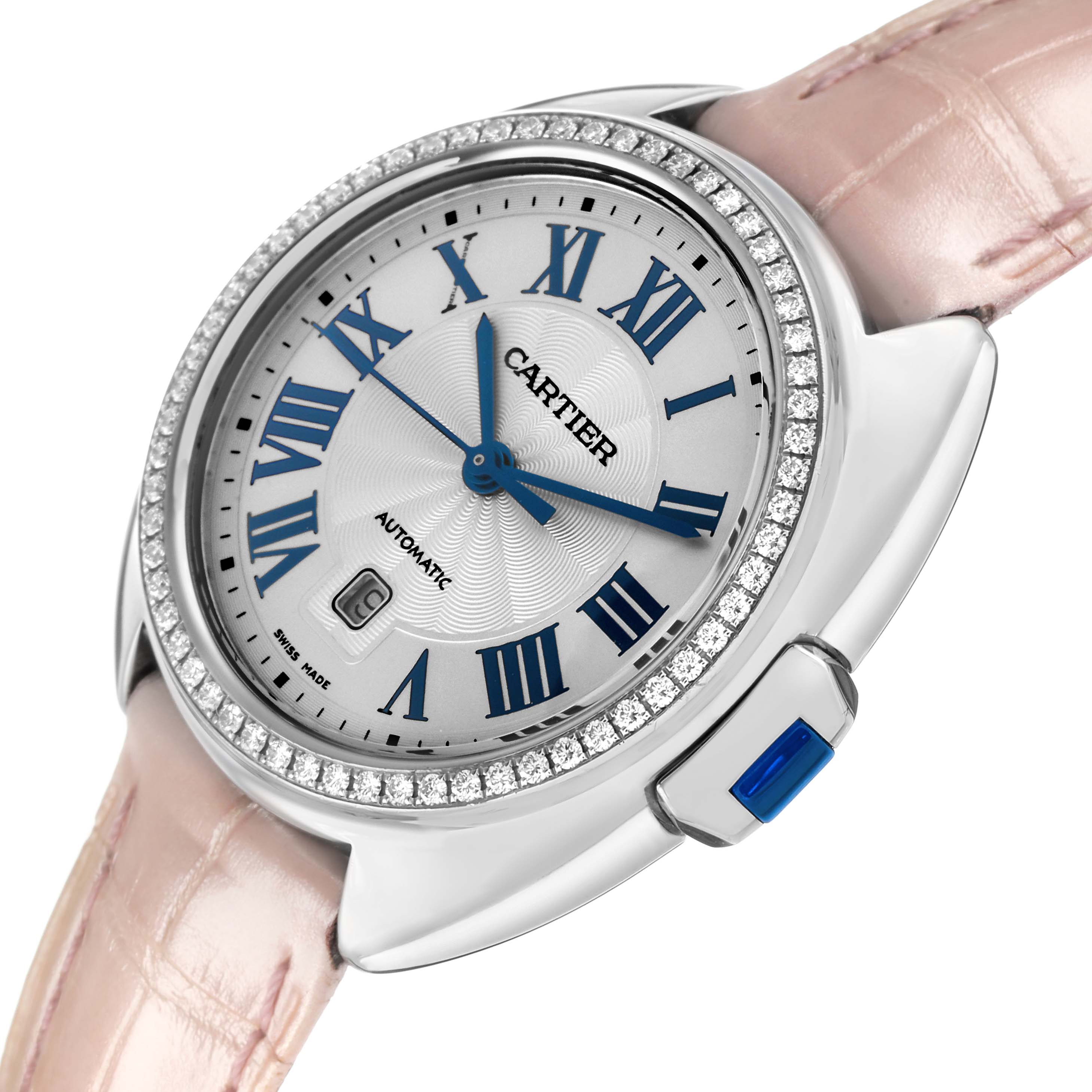 The Cartier Clé watch is shown at an angle highlighting the face, bezel, strap, and crown.