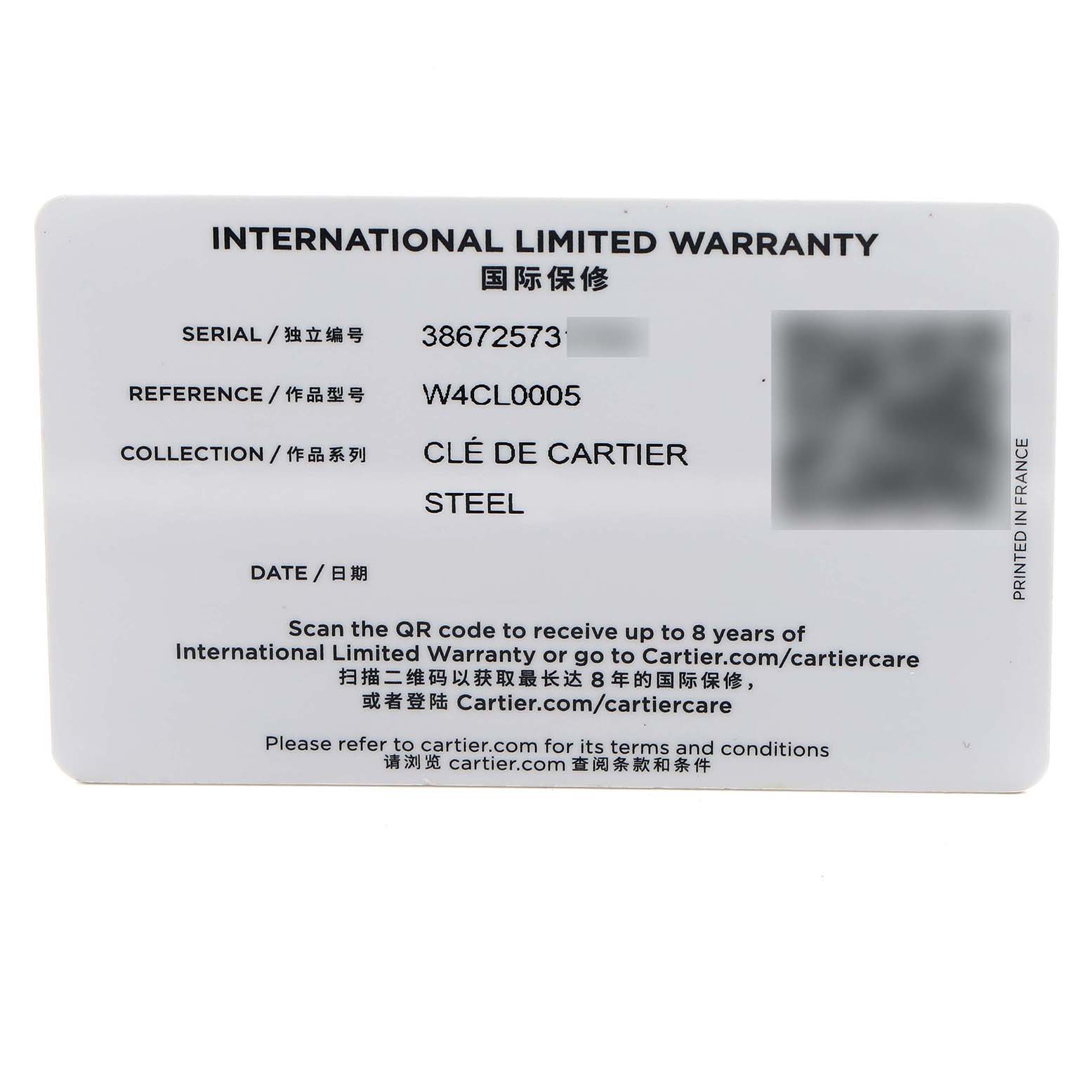 The image shows an international limited warranty card for a Clé de Cartier watch, detailing serial and reference numbers.