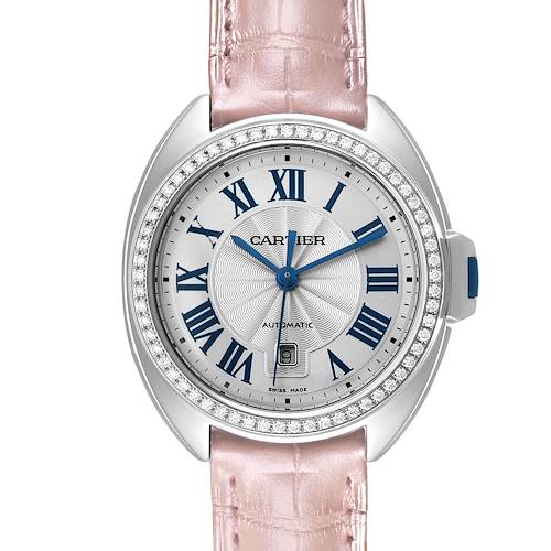 The Cartier Clé watch is shown from a front angle, displaying the dial, bezel, crown, and part of the strap.