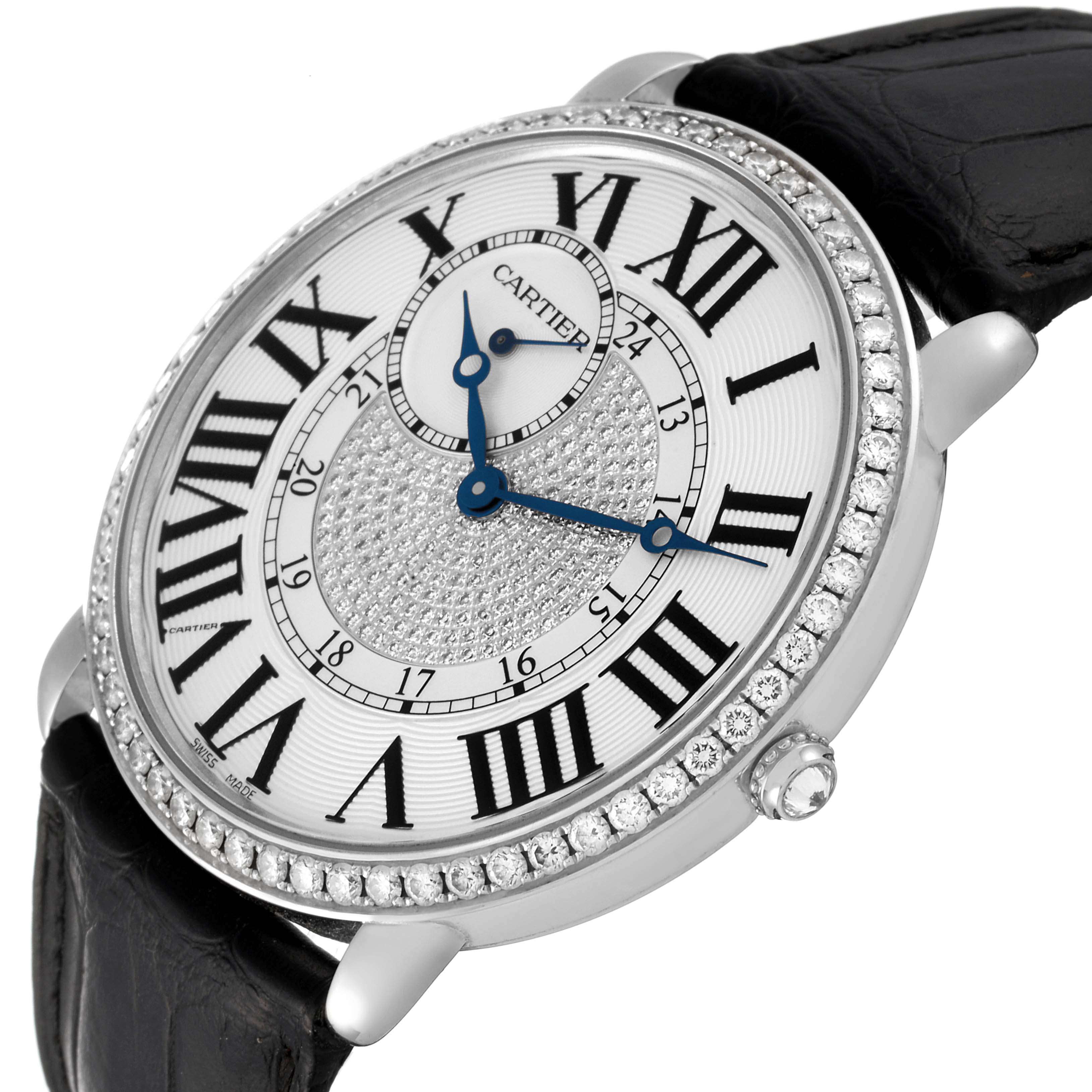 This Tank Louis Cartier watch is shown at an angled view, displaying its Roman numeral dial, diamond bezel, and black leather strap.