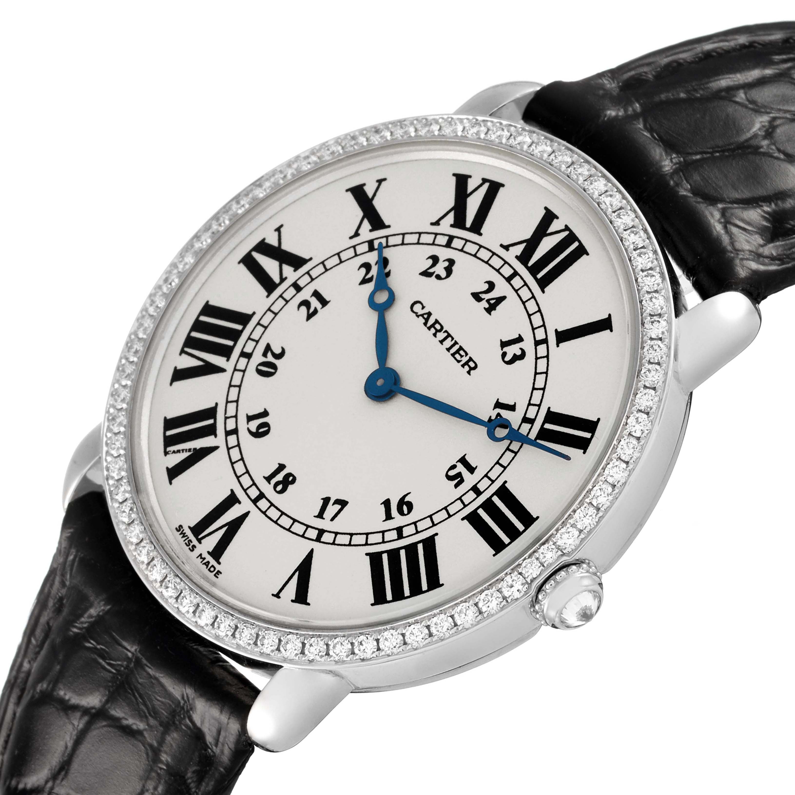 The Cartier Ronde WR000551 Women's White Gold Silver Dial watch is shown at an angle highlighting the face with Roman numerals and a diamond-studded bezel, along with its black leather strap.