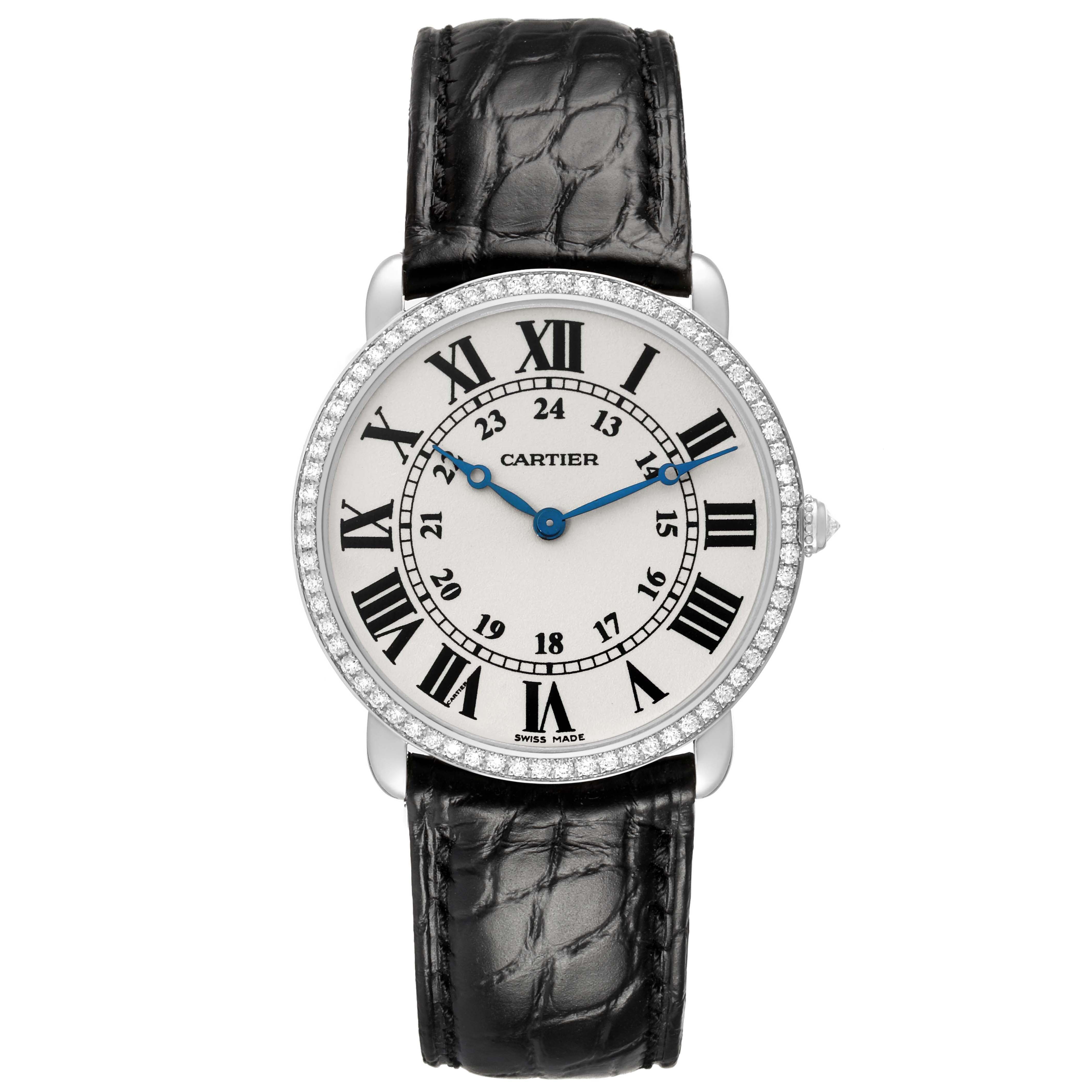 The Cartier Ronde WR000551 Women's White Gold Silver Dial watch is shown from the front, displaying the dial, blue hands, Roman numerals, and black leather strap.