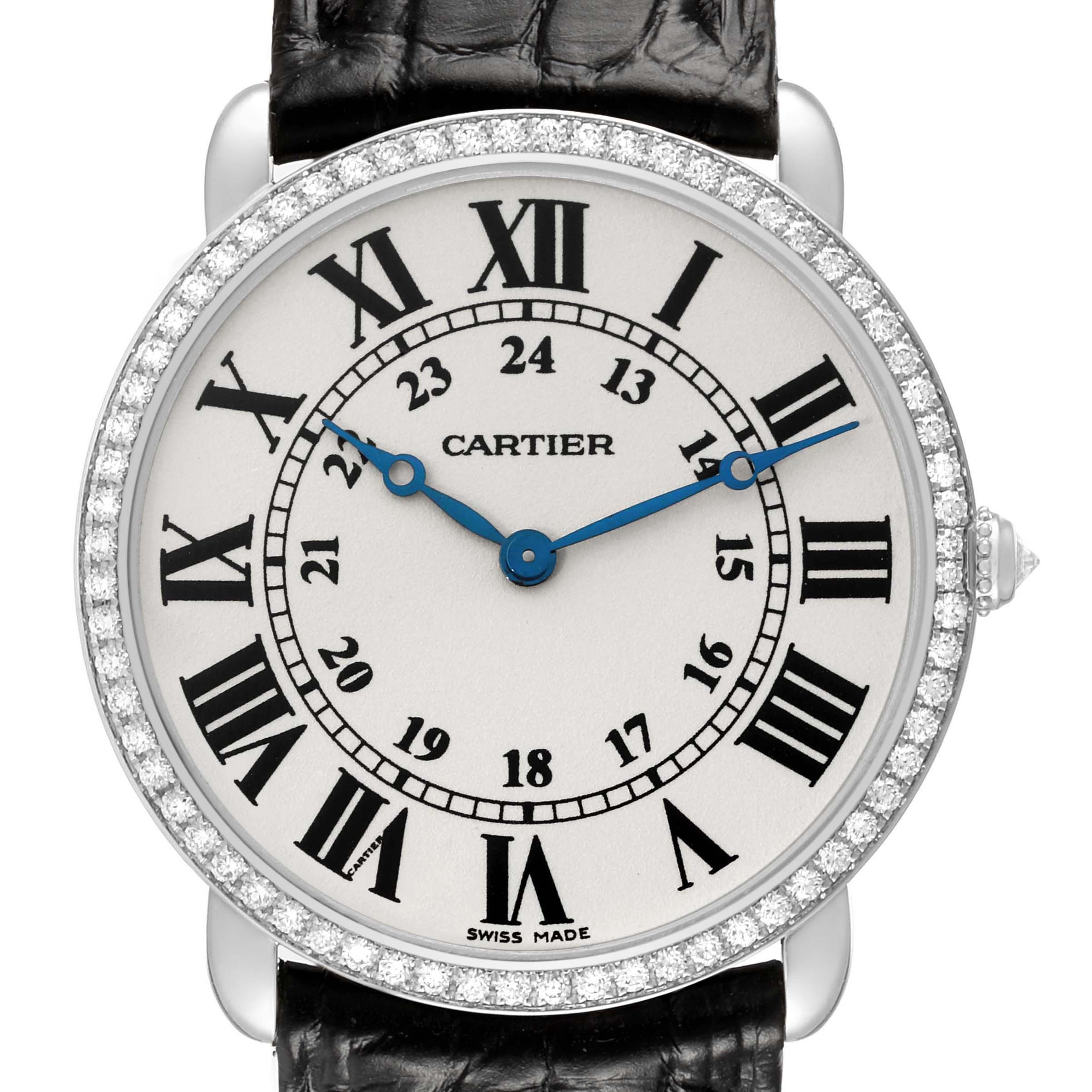 The image shows a Cartier Ronde WR000551 Women's White Gold Silver Dial watch face-on, displaying the Roman numerals, blue hands, diamond bezel, and black leather strap.