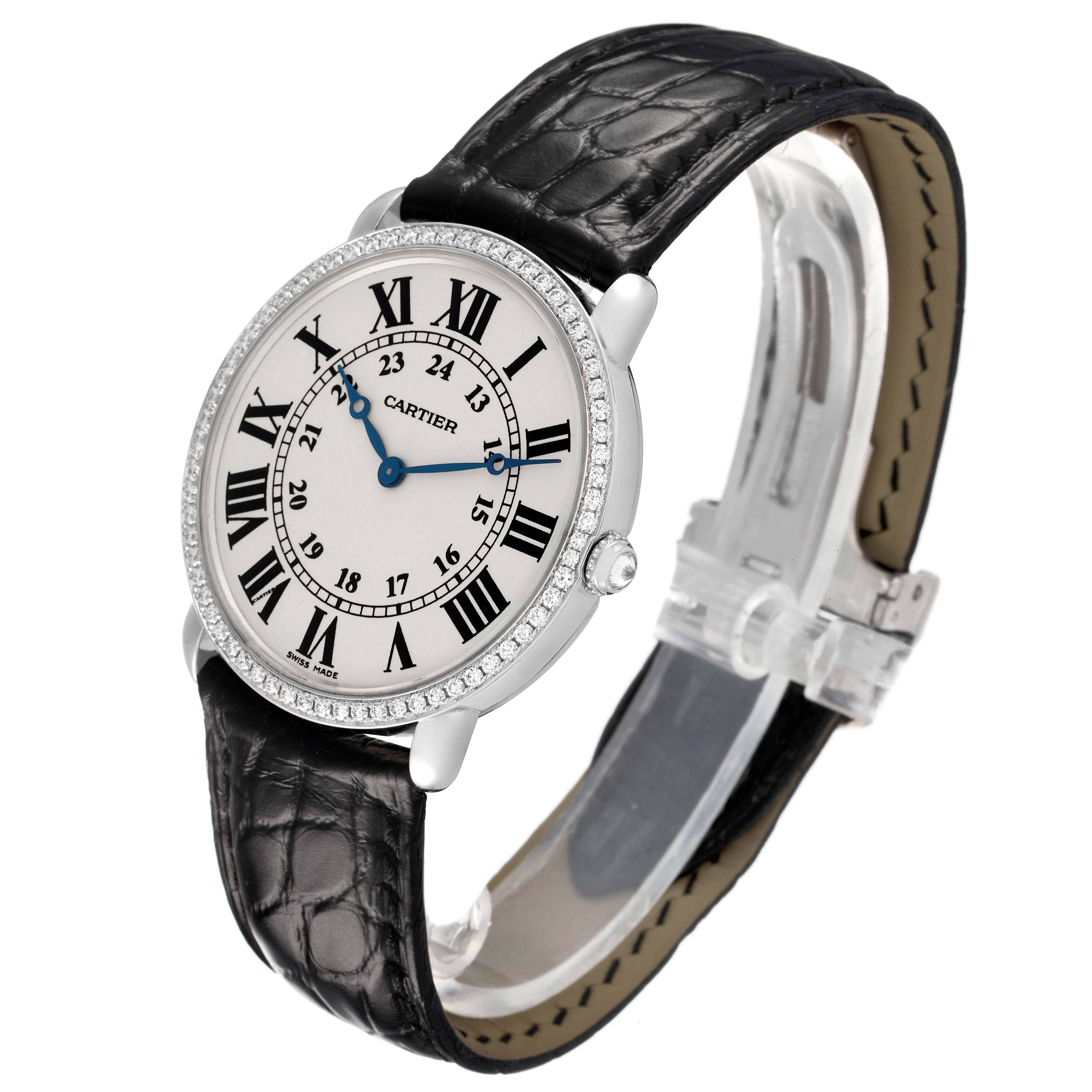 The Cartier Ronde WR000551 Women's White Gold Silver Dial watch is shown at a slight angle, displaying the face, Roman numerals, and black leather strap.