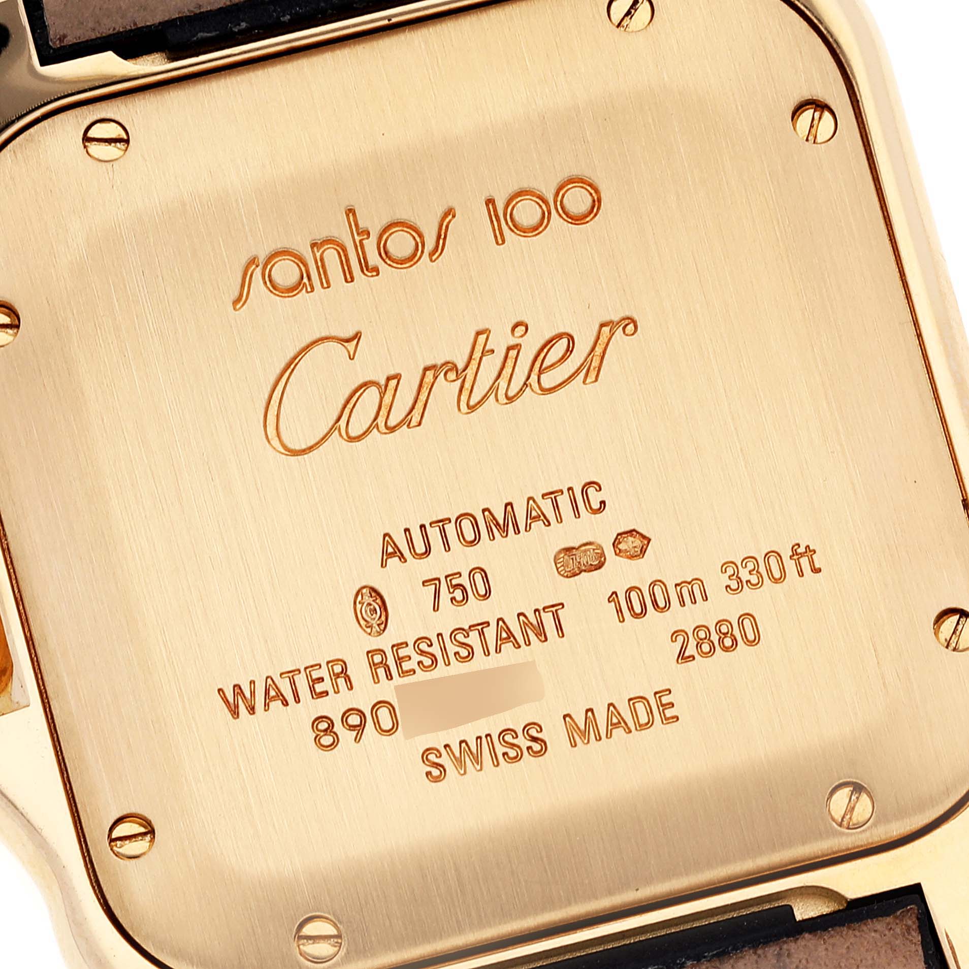 The image shows the case back of a Cartier Santos WM502051 Men
s Yellow Gold Silver Dial WM502051 Men
s Yellow Gold Silver Dial 100 watch with engraved specifications and markings.