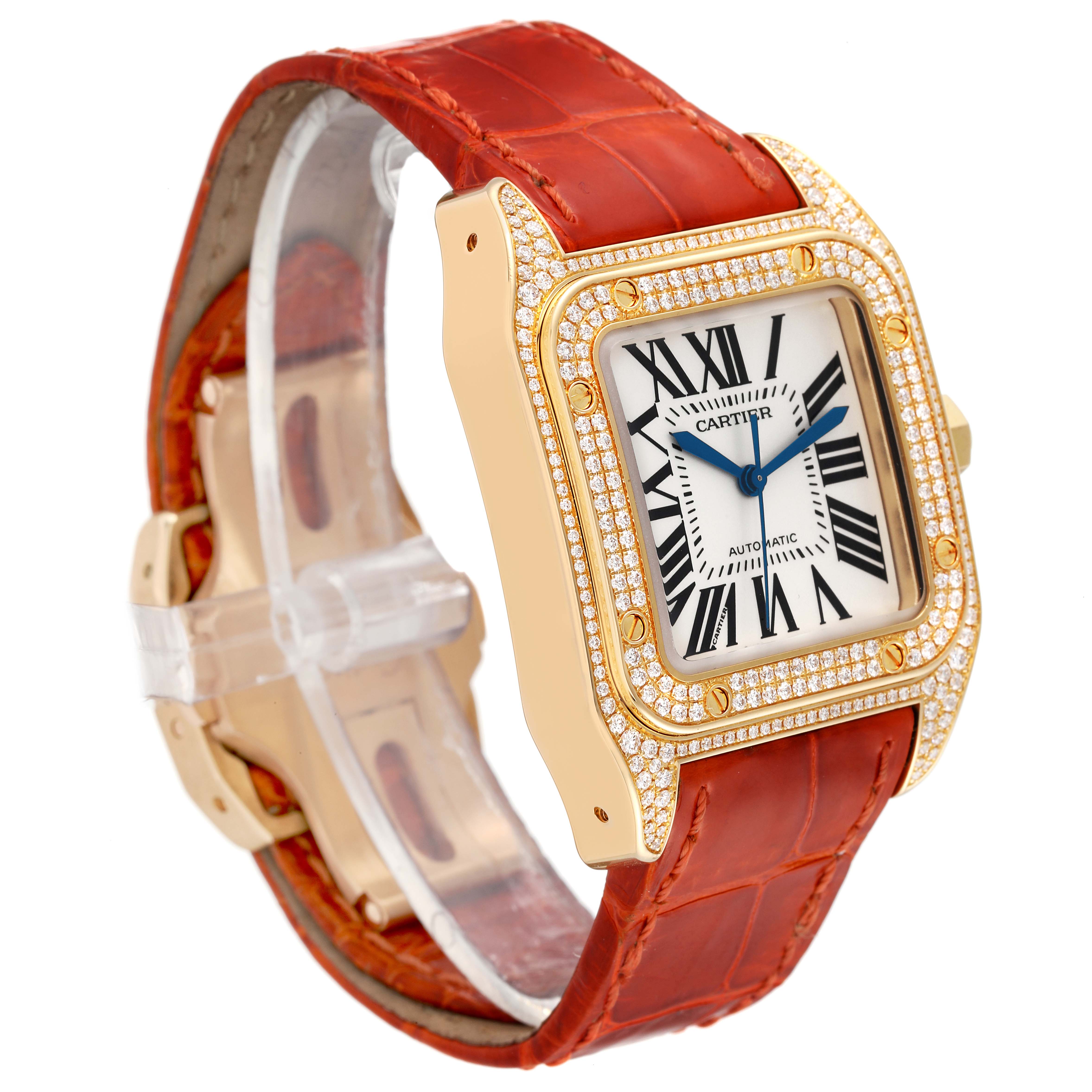 The Cartier Santos WM502051 Men
s Yellow Gold Silver Dial WM502051 Men
s Yellow Gold Silver Dial watch is shown at a three-quarter angle, highlighting its gold case with diamonds and red leather strap.