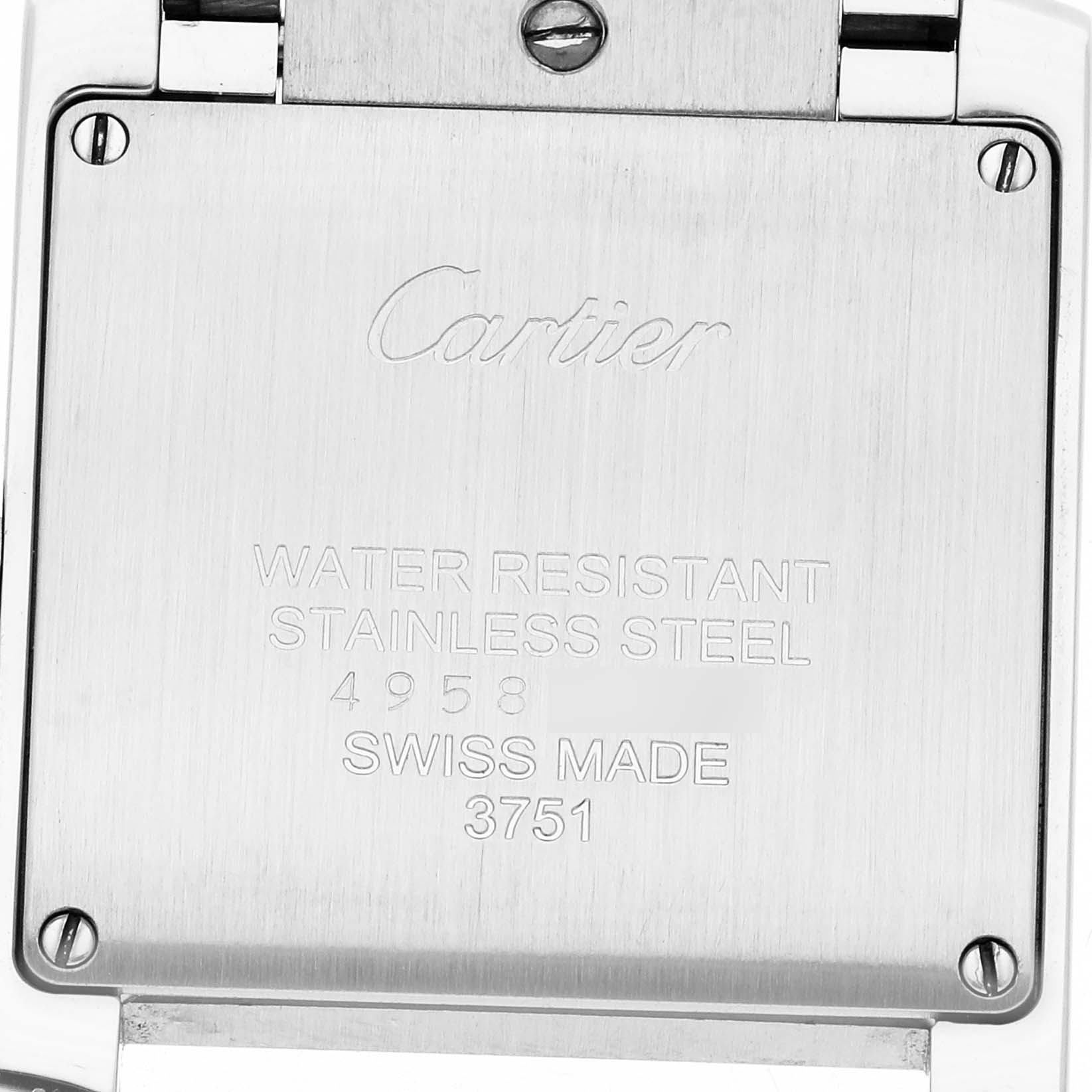 The image shows the back case of a Cartier Tank Française watch, featuring engravings and screws.