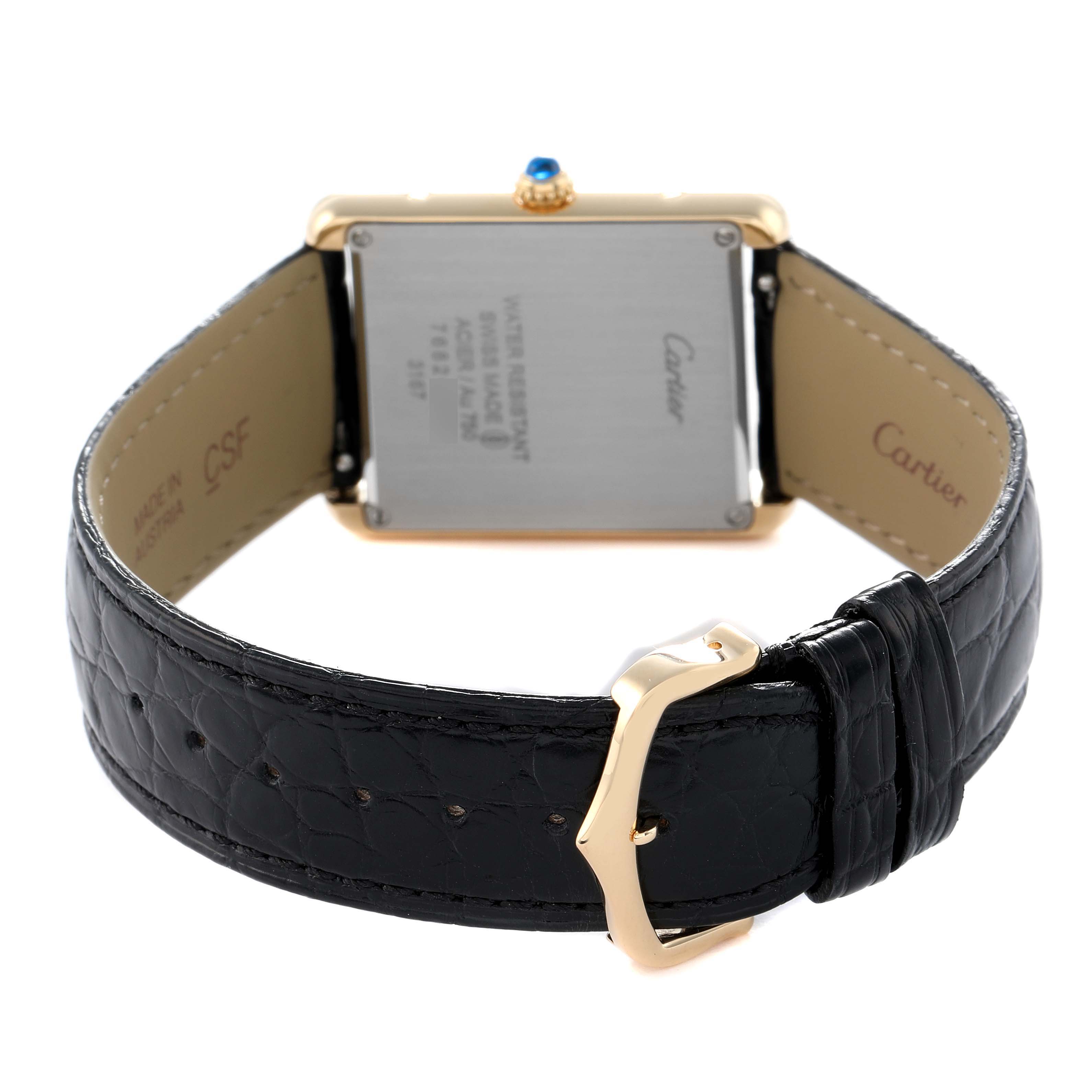 The Cartier Tank Solo W5200004 Men's Steel and Gold (two tone) Silver Dial watch is shown from the back, displaying its rectangular case, strap, and buckle.