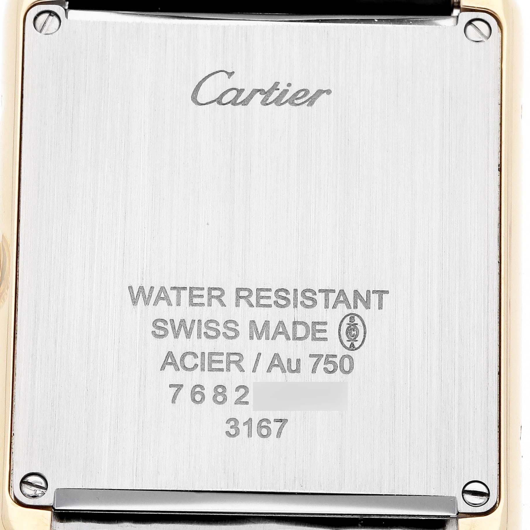The image shows the back case of the Cartier Tank Solo W5200004 Men's Steel and Gold (two tone) Silver Dial watch, displaying brand markings and specifications.