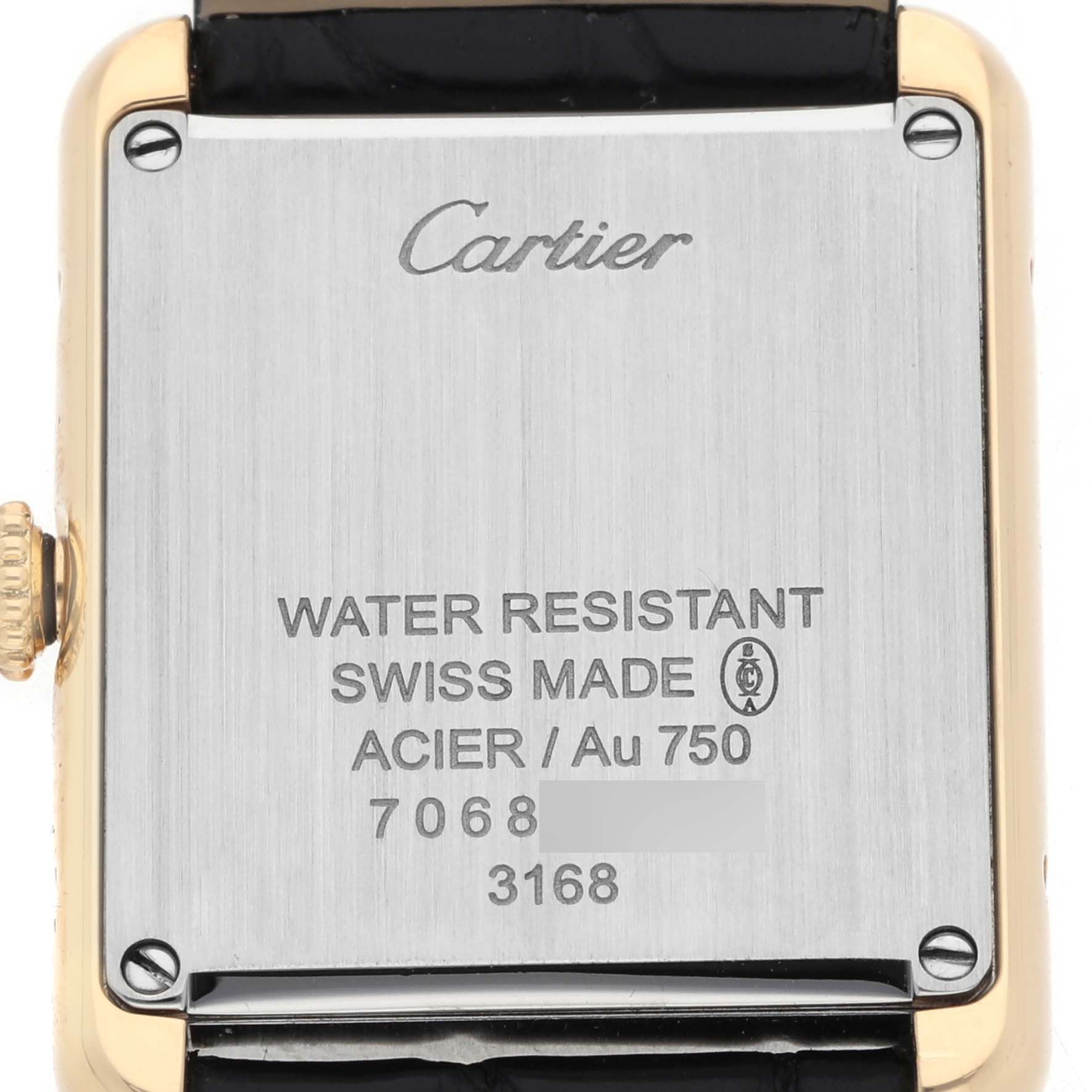 The image shows the back case of a Cartier Tank Solo W5200002 Women's Steel and Gold (two tone) Silver Dial watch, highlighting brand engraving and specifications.
