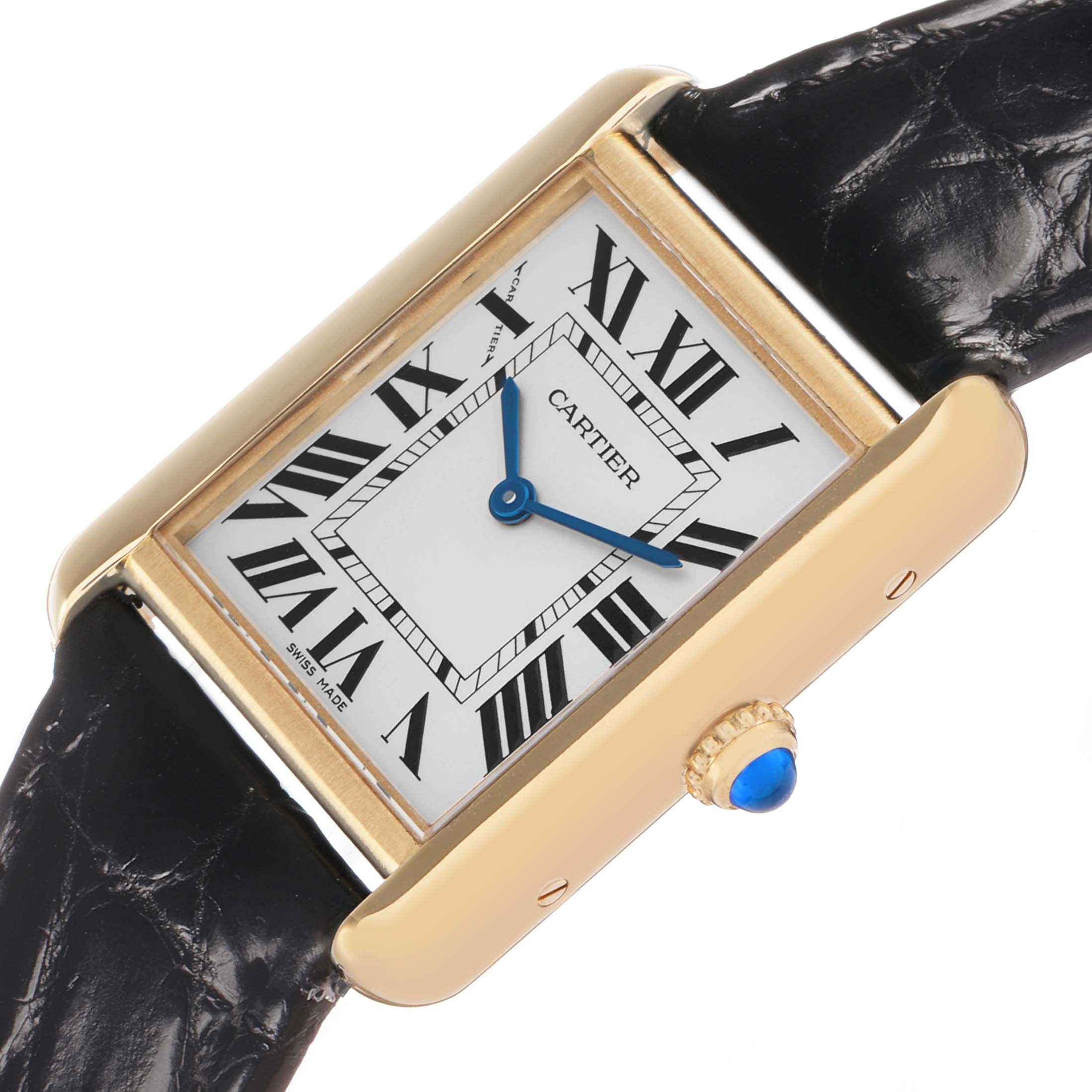 The Cartier Tank Solo W5200002 Women's Steel and Gold (two tone) Silver Dial watch is shown at an angled side view, highlighting its rectangular case, roman numeral dial, and blue gemstone crown.