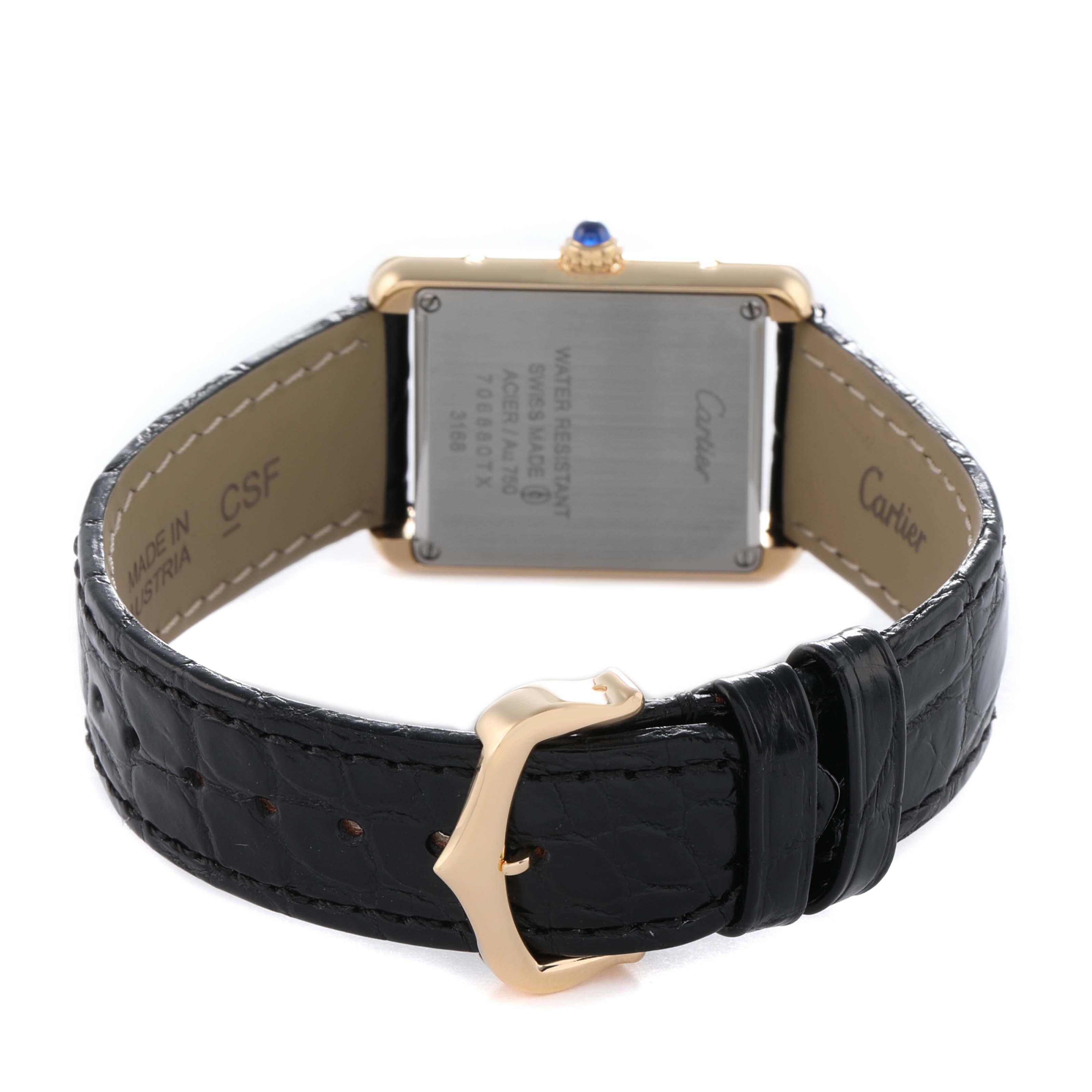 The Cartier Tank Solo W5200002 Women's Steel and Gold (two tone) Silver Dial watch is shown from the back, displaying its case back, crown, and black leather strap with a buckle.