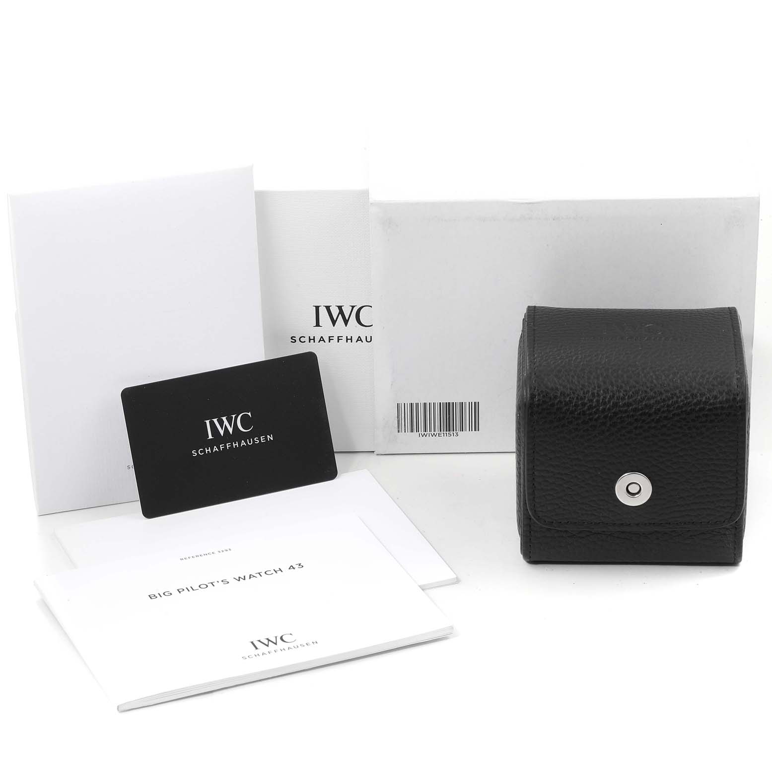 The image shows IWC Pilot IW329303 Men
s Stainless Steel Blue Dial IW329303 Men
s Stainless Steel Blue Dial model accessories, including a black case, warranty card, manuals, and packaging, viewed from above.