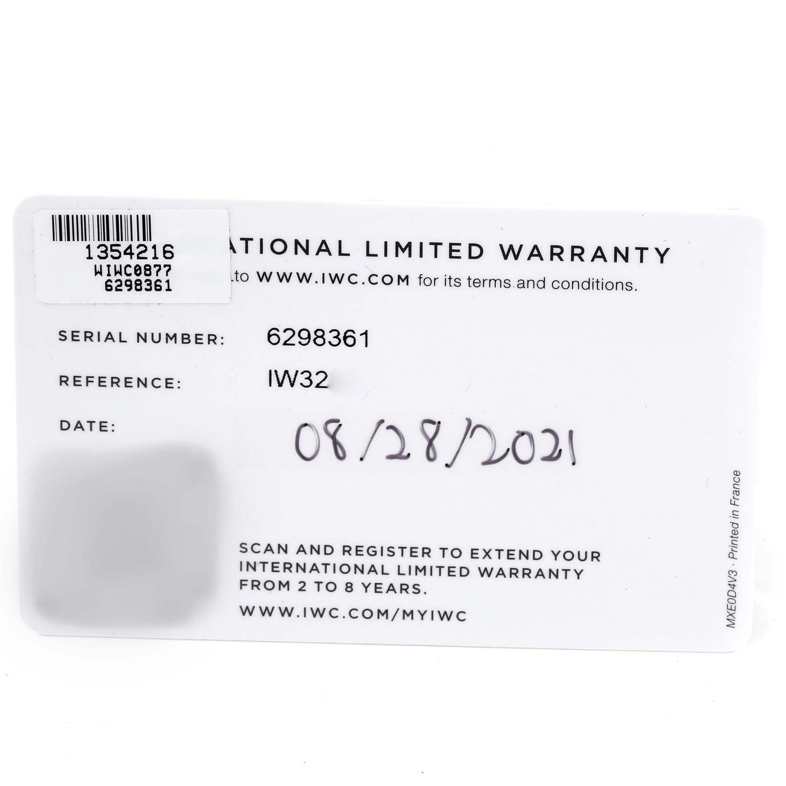 This image shows the warranty card for the IWC Pilot IW329303 Men
s Stainless Steel Blue Dial IW329303 Men
s Stainless Steel Blue Dial model watch, including the serial number and reference number.
