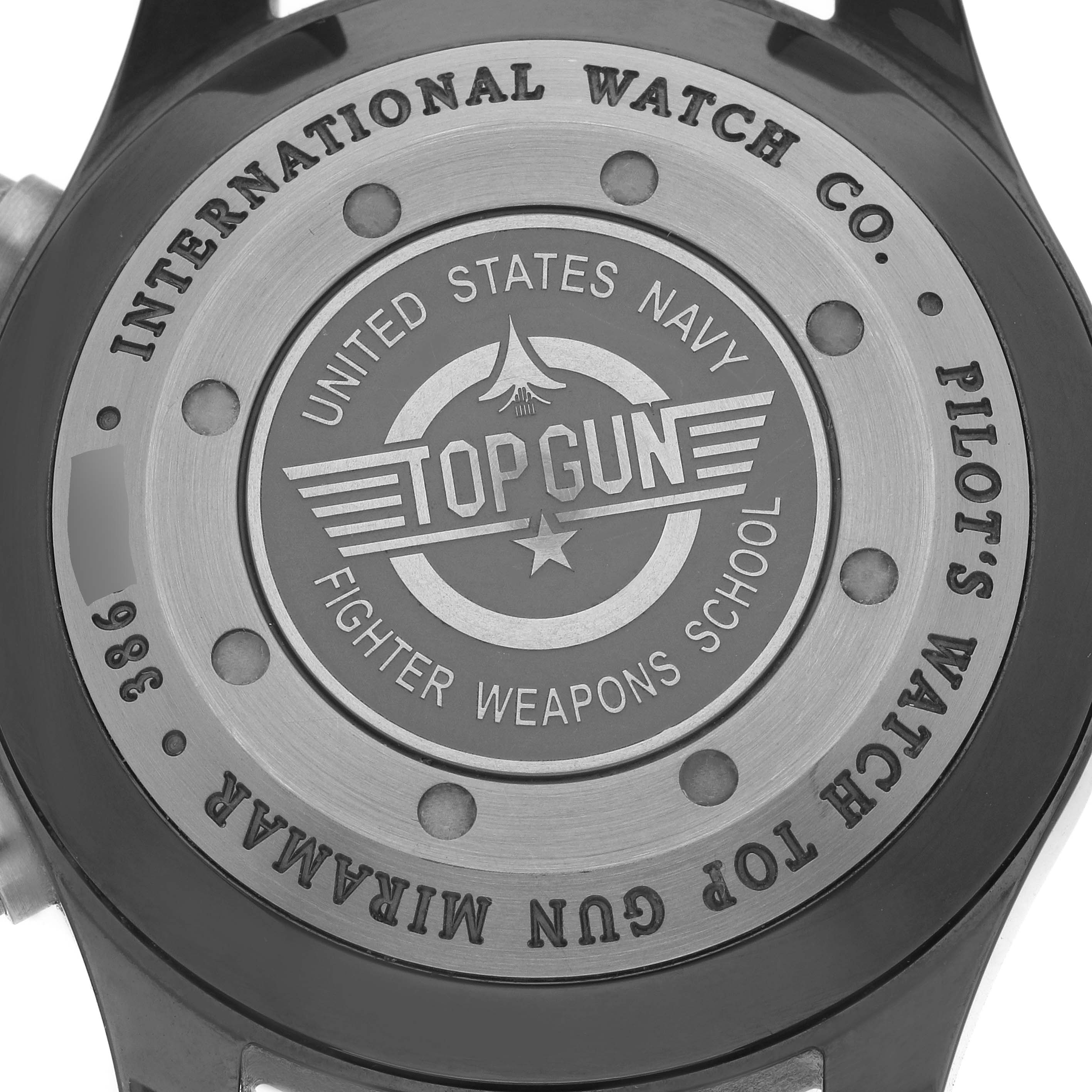 The image shows the case back of an IWC Pilot IW388002 Men's Ceramic Grey Dial watch, featuring a "Top Gun" engraving.