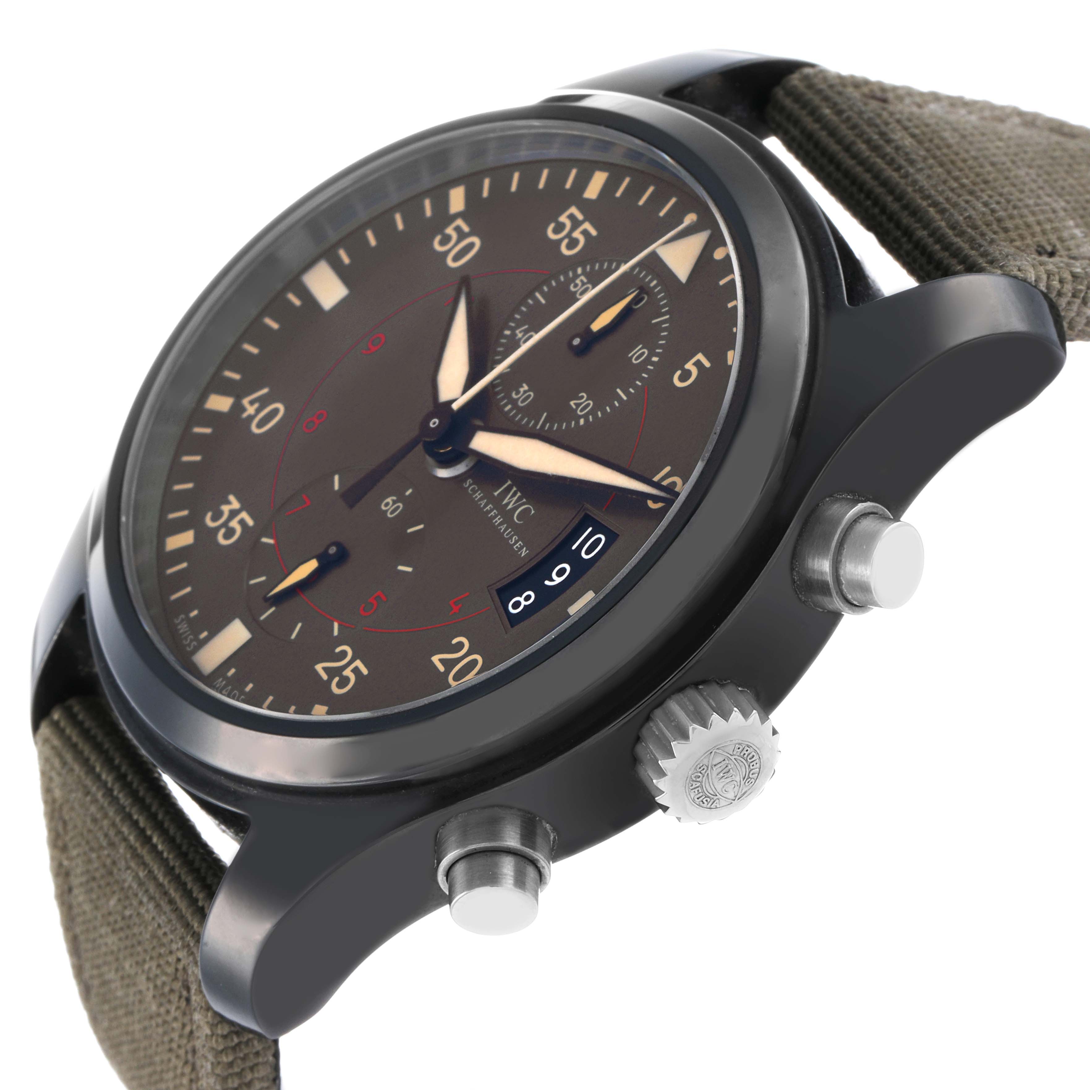 The IWC Pilot IW388002 Men's Ceramic Grey Dial watch is shown at a slight angle, displaying the face, bezel, crown, and pushers, with a fabric strap visible.
