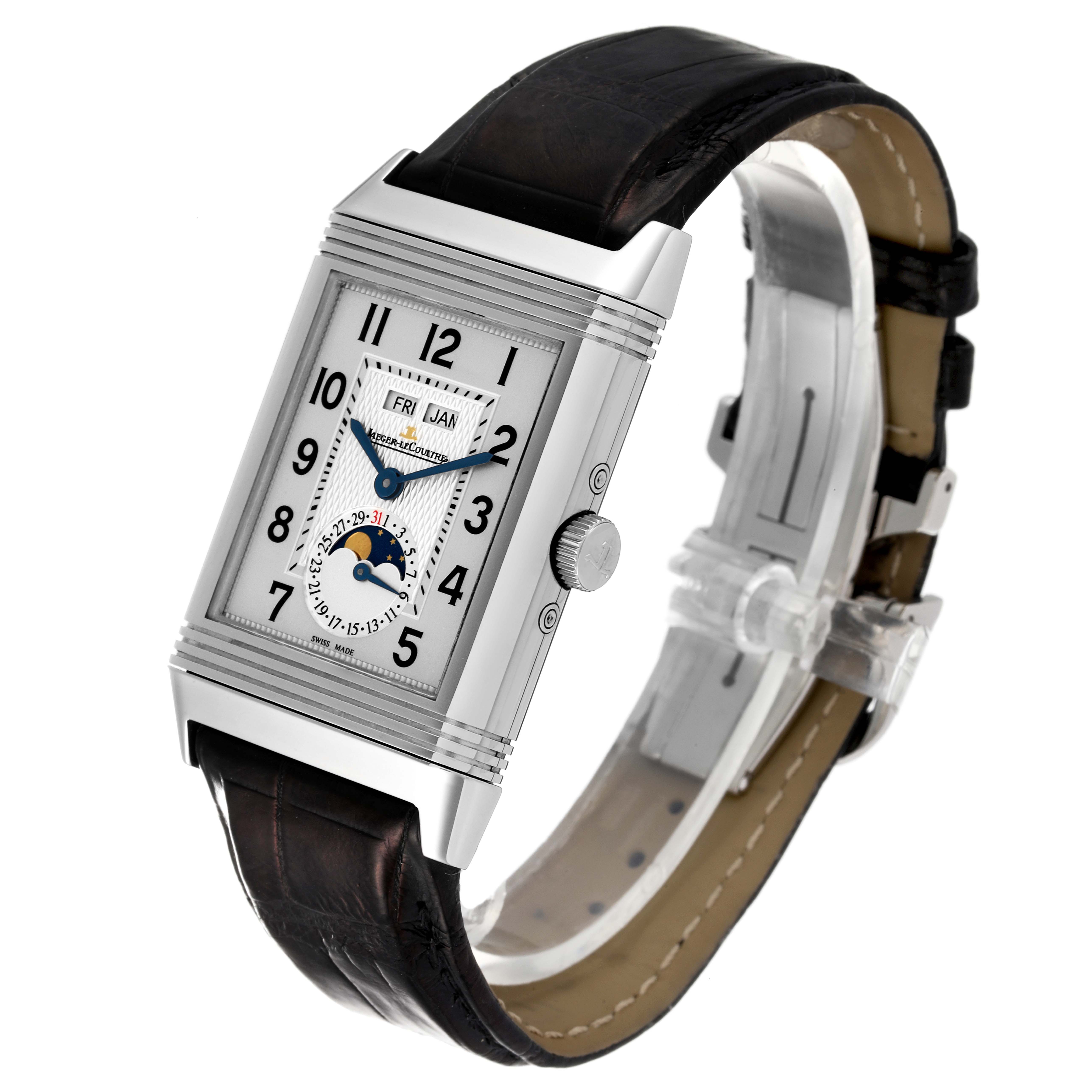 The Jaeger-LeCoultre Reverso watch is shown at an angle displaying the face, crown, and leather strap.