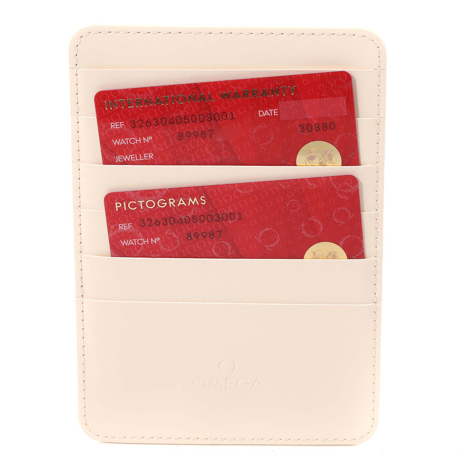 This image shows warranty and pictogram cards for an Omega Speedmaster 326.30.40.50.03.001 Men
s Stainless Steel Blue Dial 326.30.40.50.03.001 Men
s Stainless Steel Blue Dial watch in a beige cardholder.