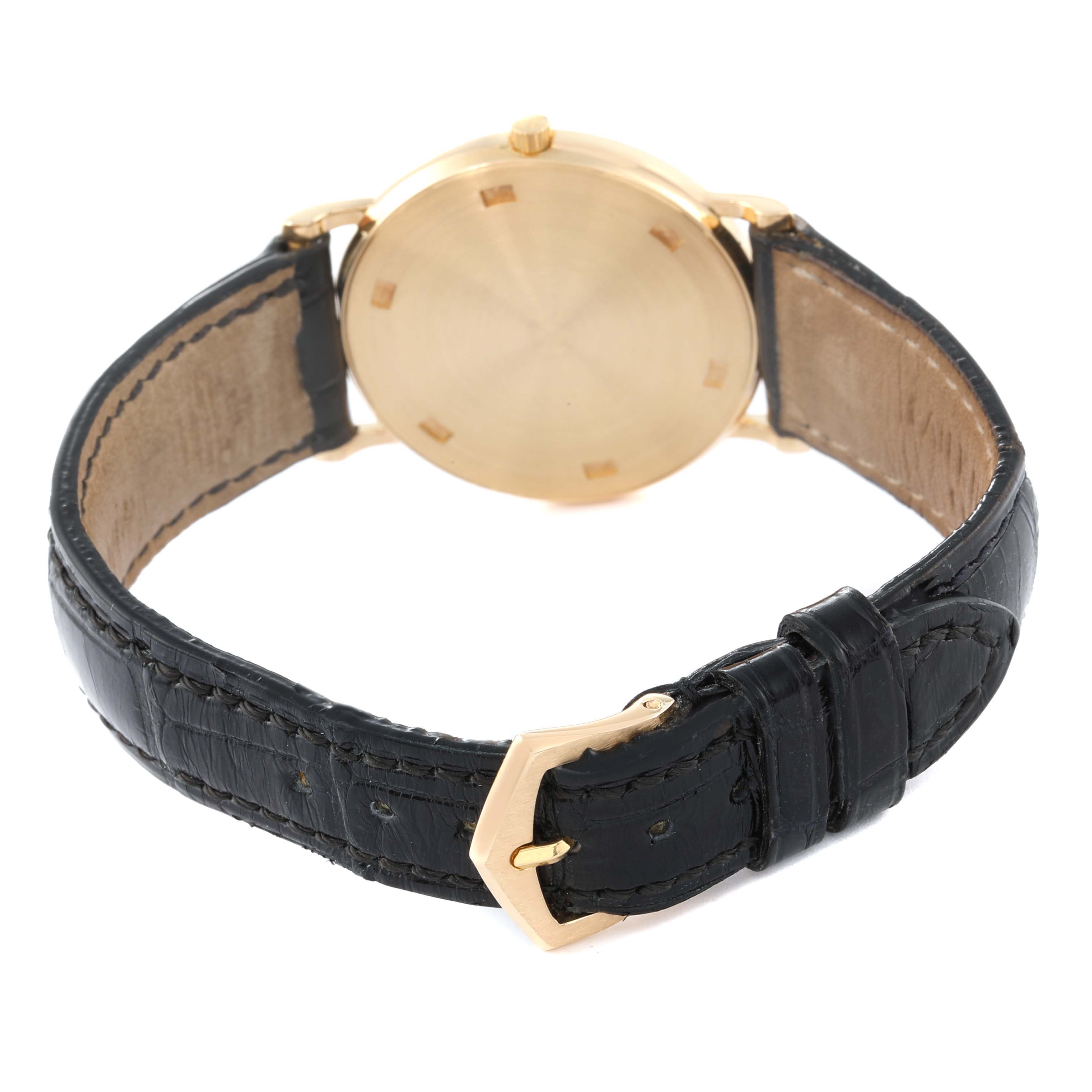 The image shows the back case and leather strap of a Patek Philippe Calatrava 3520 Men's Yellow Gold White Dial 3520 Men's Yellow Gold White Dial watch at an angled rear view.