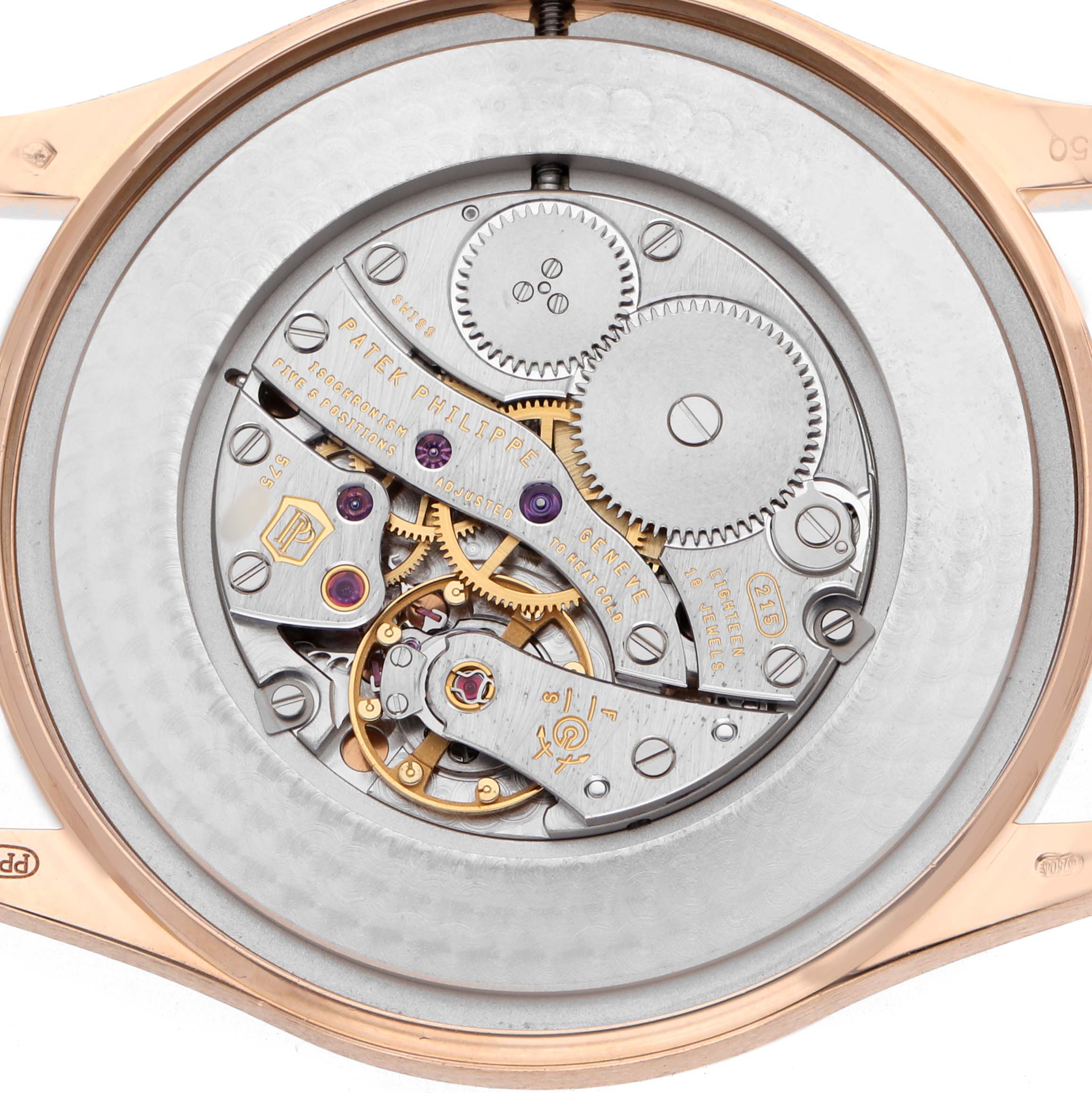 The image shows the back view of a Patek Philippe Calatrava 5196R Men's Rose Gold Grey Dial, highlighting its intricate mechanical movement.