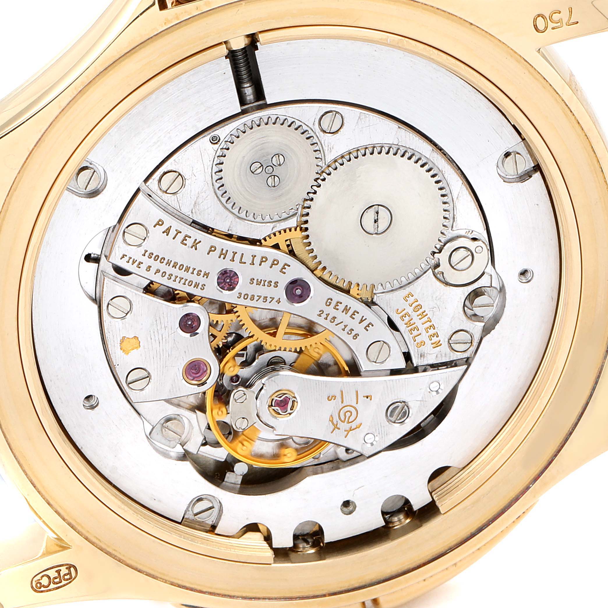 The image shows the back view of a Patek Philippe Calatrava 5134J Men
s Yellow Gold White Dial 5134J Men
s Yellow Gold White Dial watch, revealing its intricate mechanical movement.