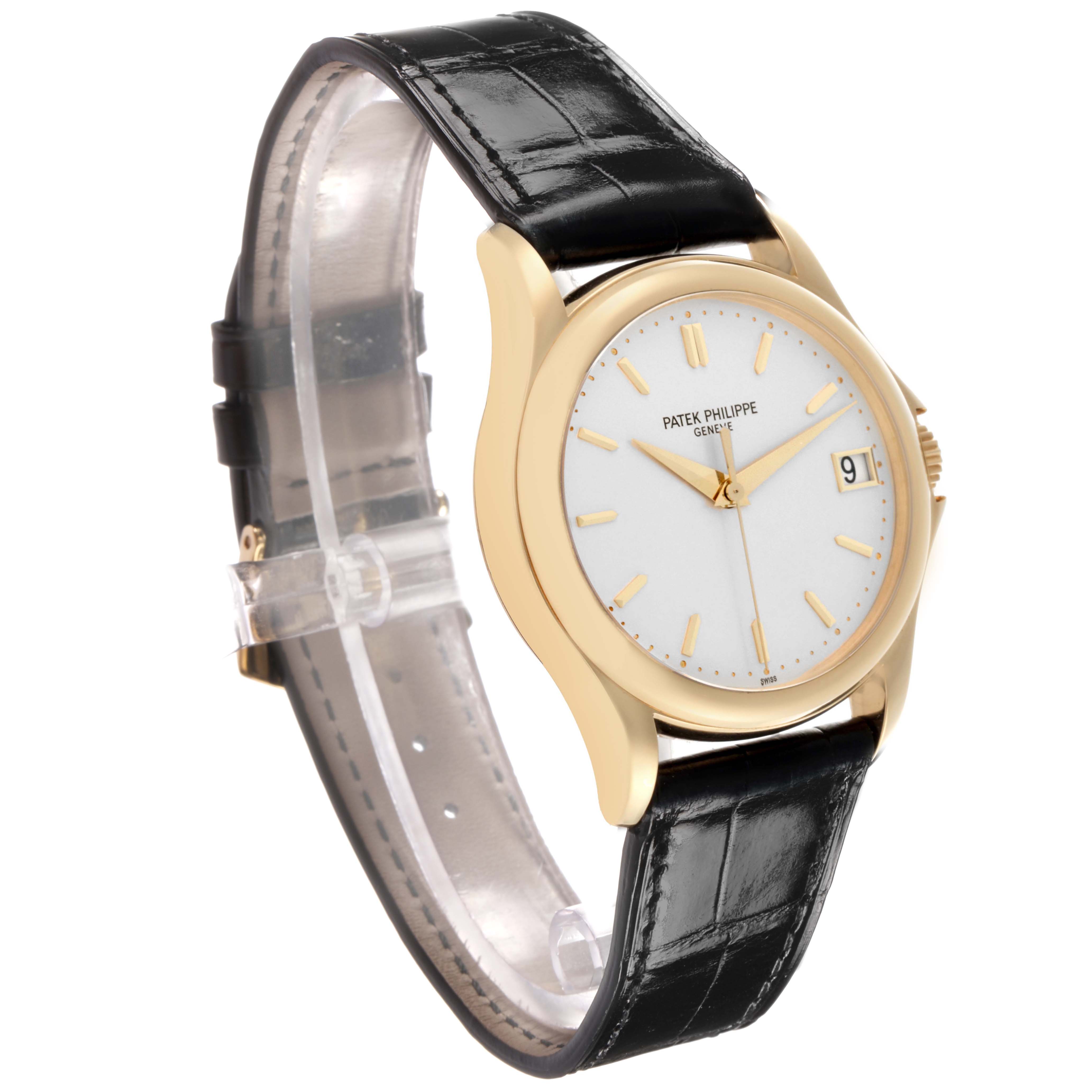 The image shows a side view of a Patek Philippe Calatrava 5107J Men's Yellow Gold Silver Dial, highlighting the watch face, case, crown, and black leather strap.
