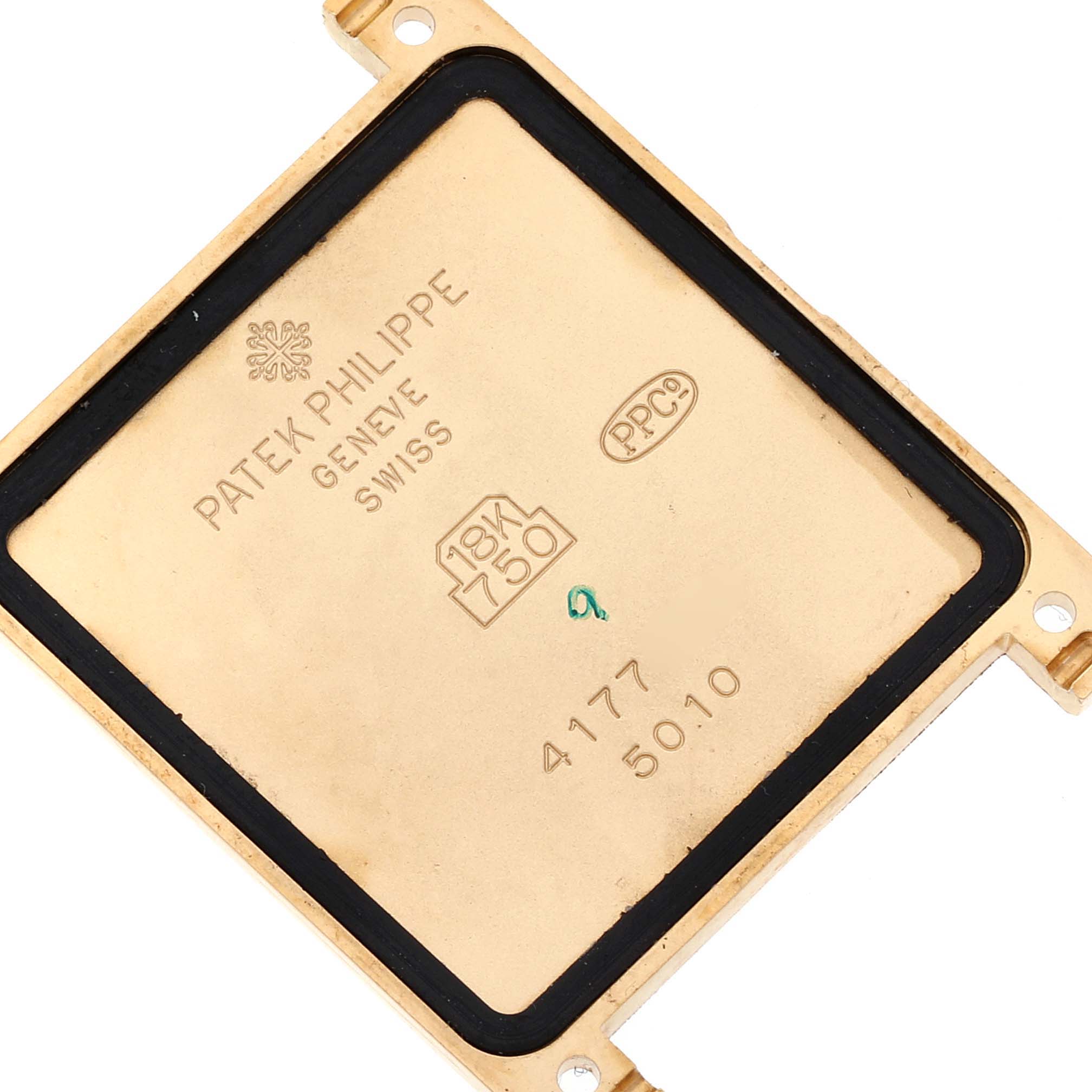 This image shows the back case cover of the Patek Philippe Gondolo 5010J Men's Yellow Gold Silver Dial 5010J Men's Yellow Gold Silver Dial watch, highlighting the engravings and material details.