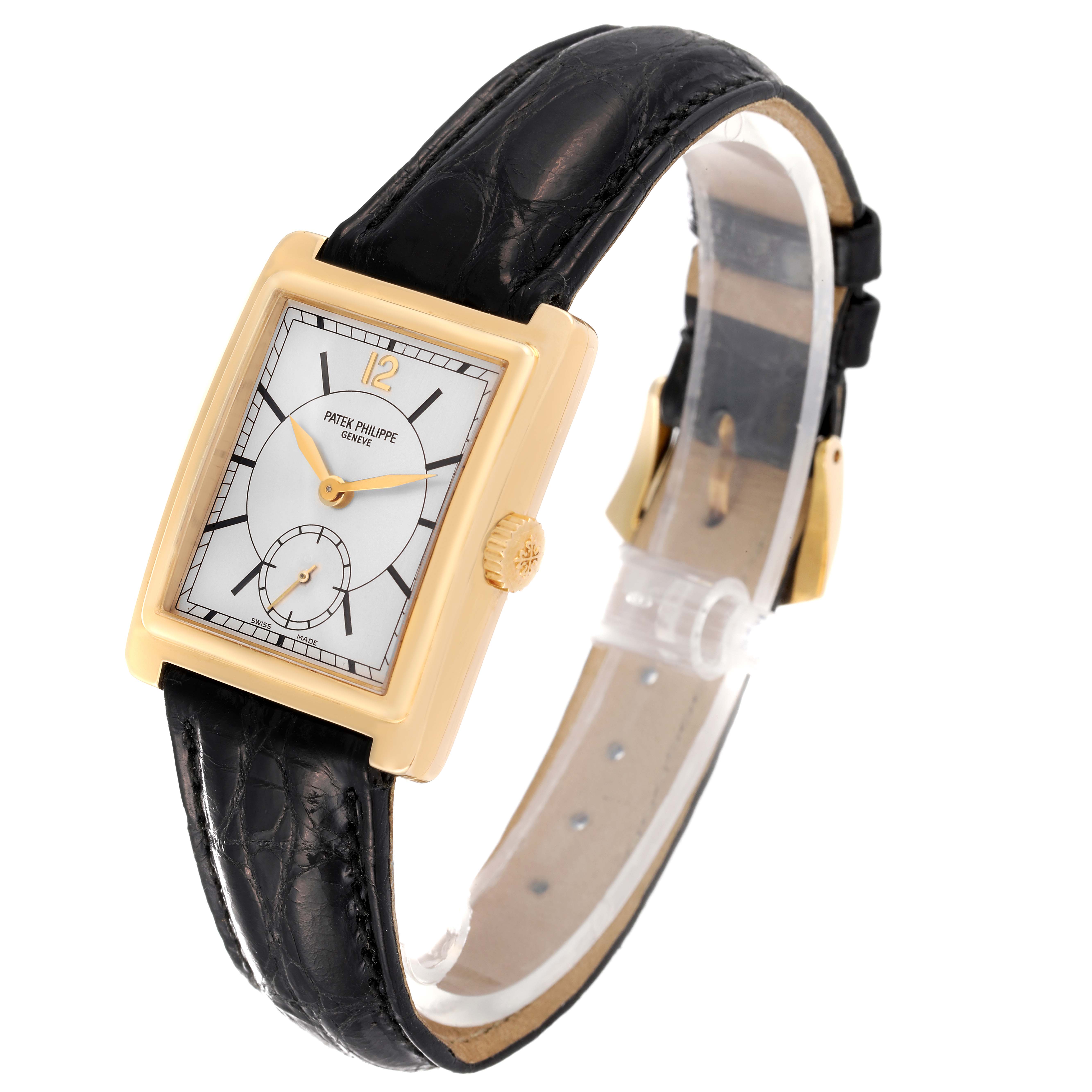 The image shows a side angle of the Patek Philippe Gondolo 5010J Men's Yellow Gold Silver Dial 5010J Men's Yellow Gold Silver Dial watch, highlighting its rectangular dial, leather strap, and gold accents.