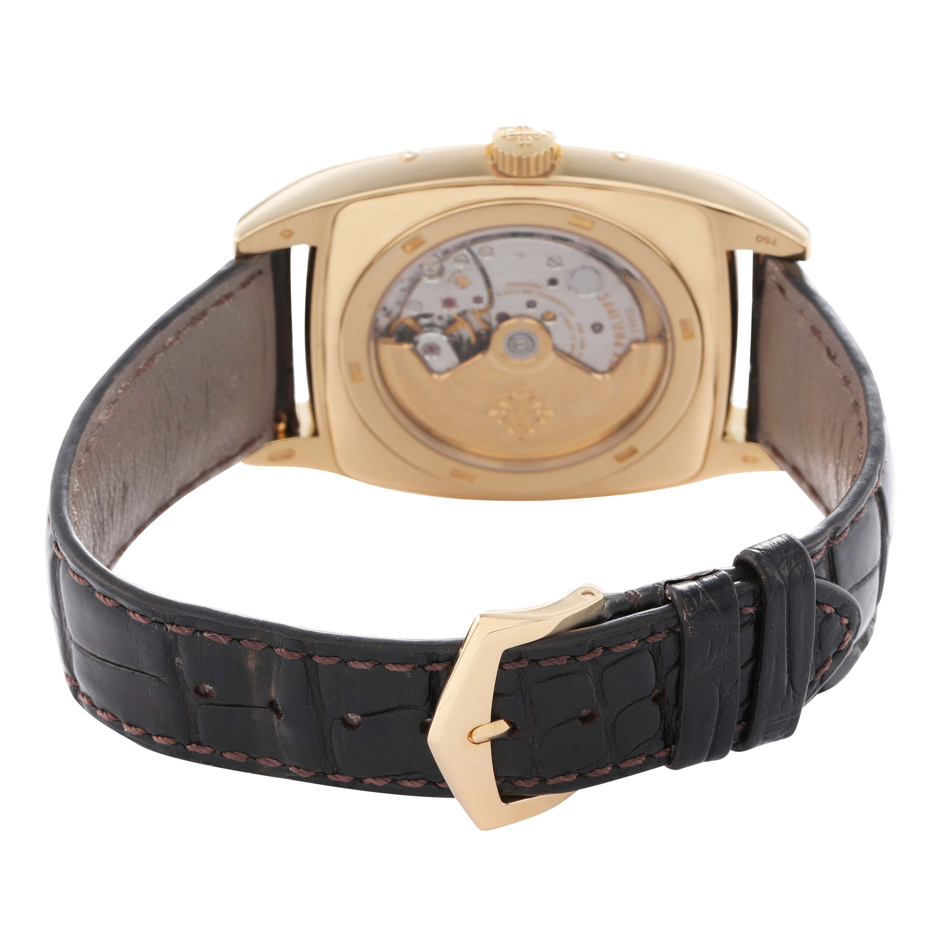 The image shows the back angle of a Patek Philippe Gondolo 5135J Men's Yellow Gold White Dial watch, highlighting its movement and leather strap.