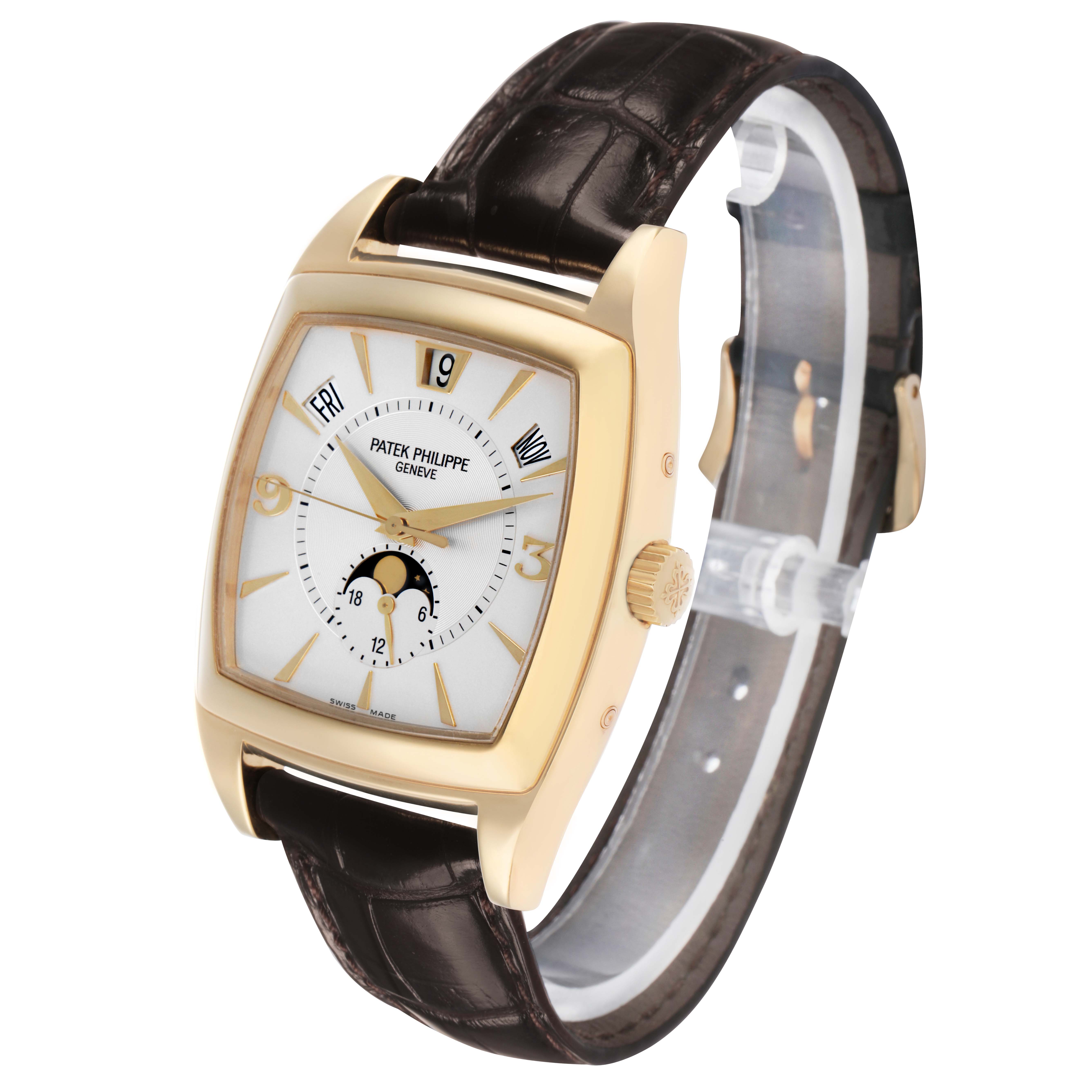 The Patek Philippe Gondolo 5135J Men's Yellow Gold White Dial watch is shown at a three-quarter angle, displaying the dial, case, crown, and strap.