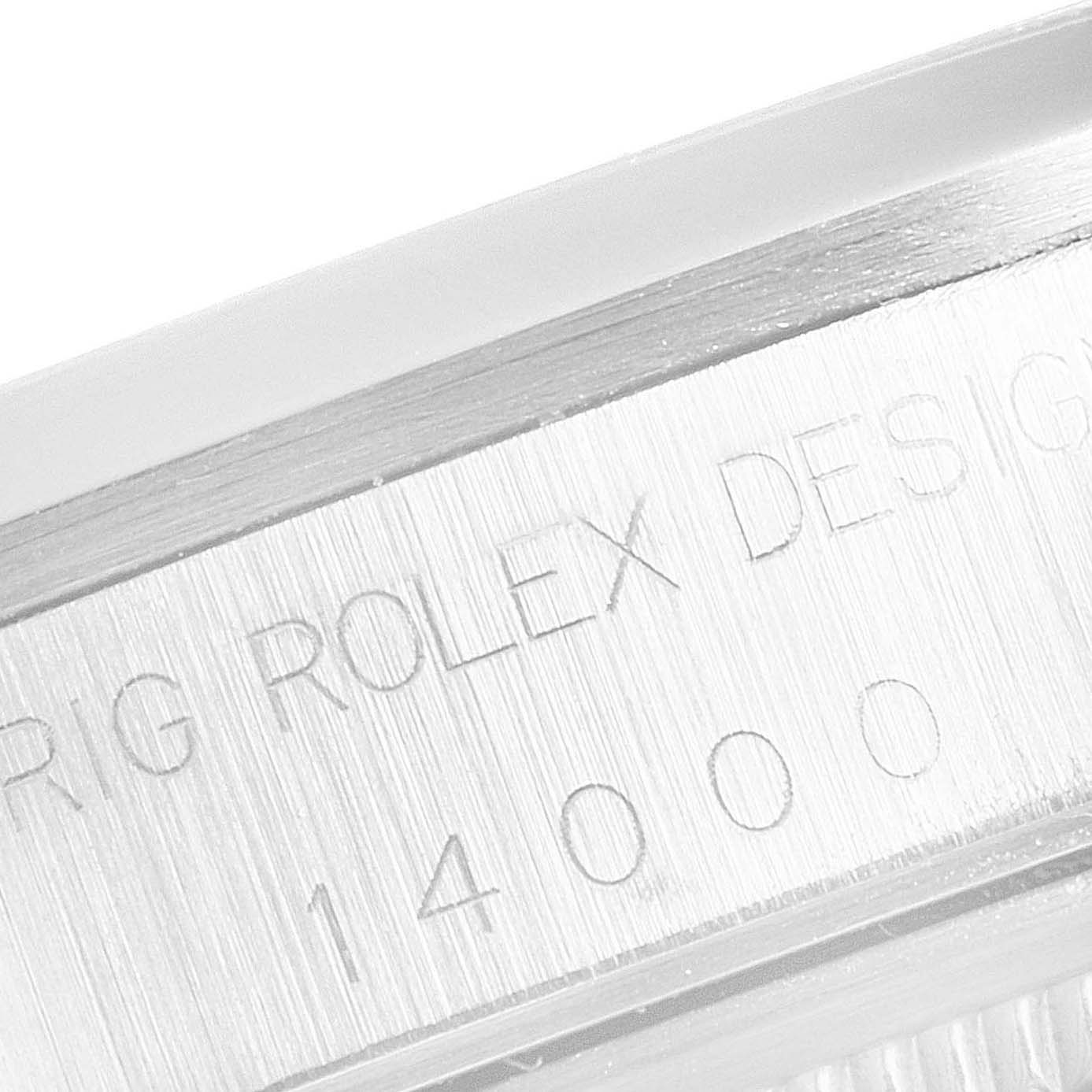 This image shows a close-up of the side of a Rolex Air-King 14000 Men's Stainless Steel Black Dial 14000 Men's Stainless Steel Black Dial watch, featuring engraved text and model number "14000."