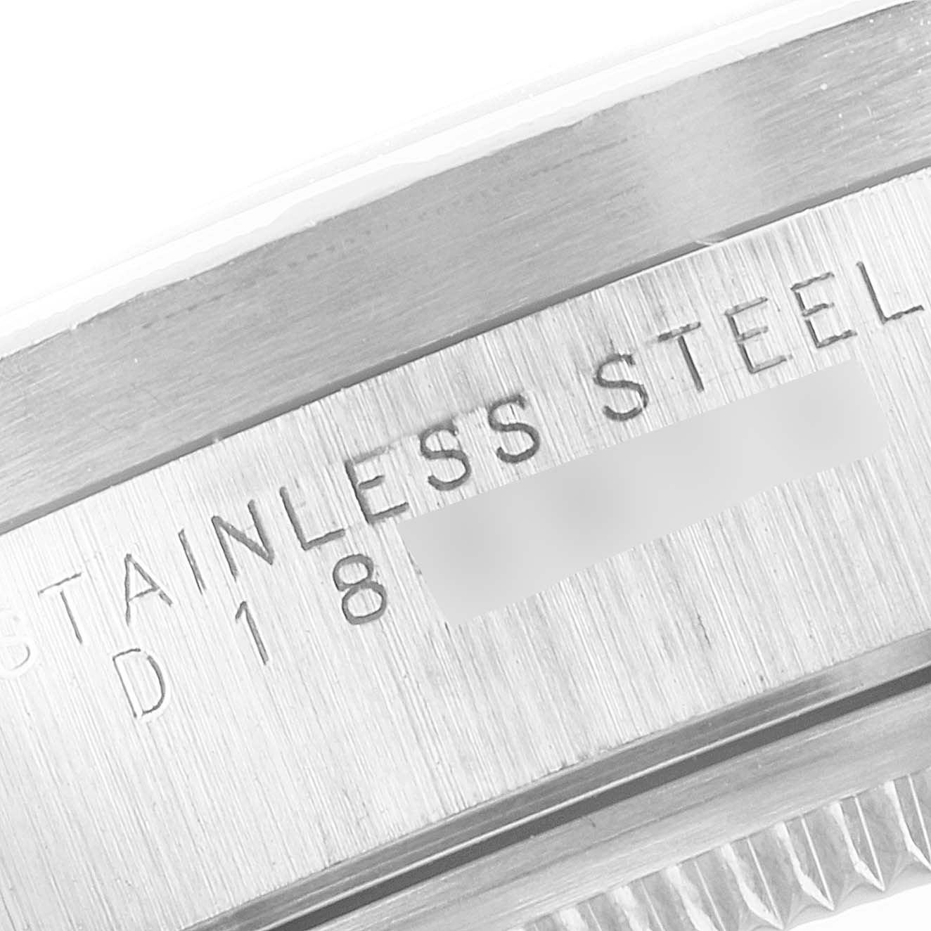 This image is a close-up of the stainless steel case and bezel edge of a Rolex Air-King 14010 Men's Stainless Steel Black Dial 14010 Men's Stainless Steel Black Dial watch.