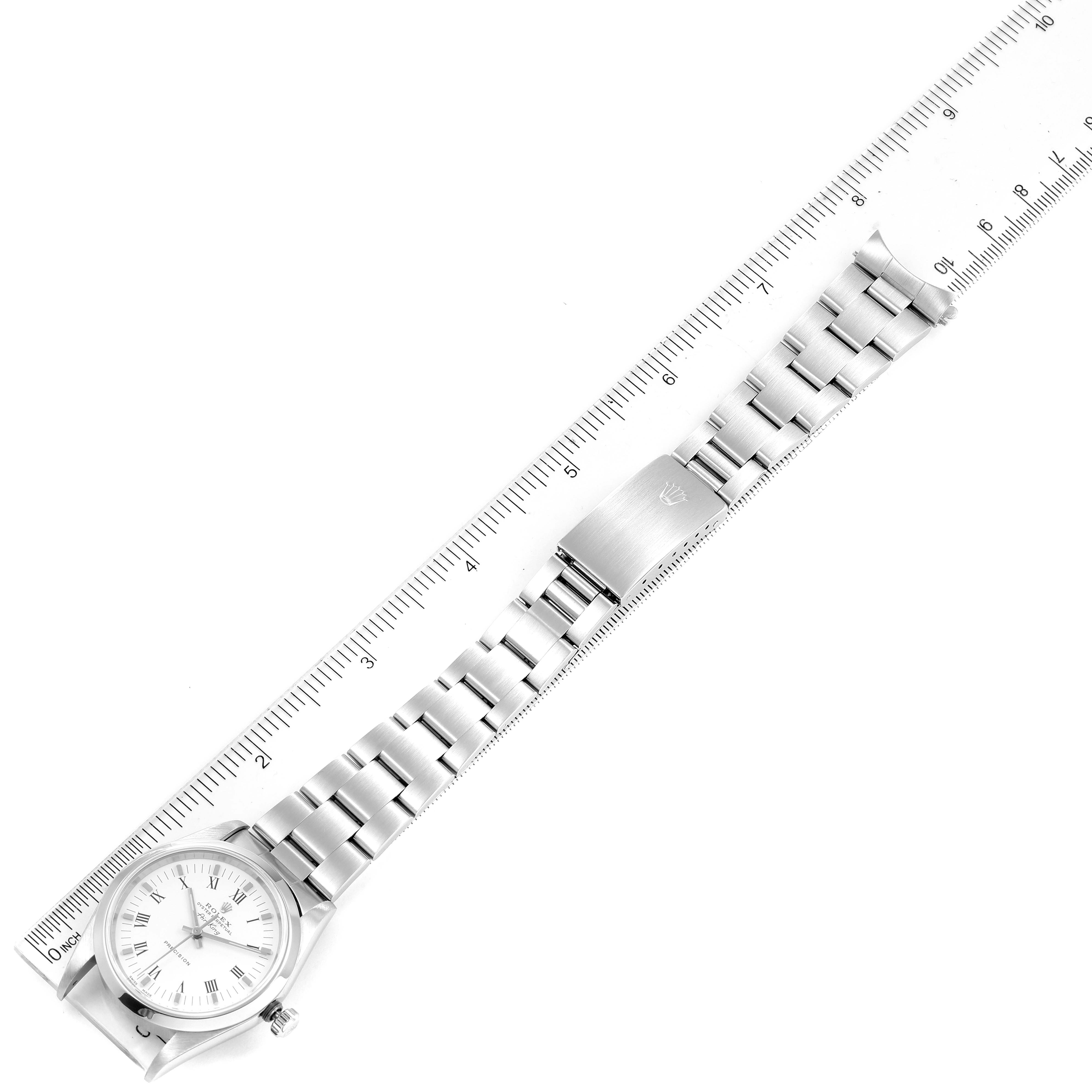 The image shows the entire Rolex Air-King 14000 Men's Stainless Steel White Dial 14000 Men's Stainless Steel White Dial watch laid flat next to a ruler, highlighting the strap and clasp.