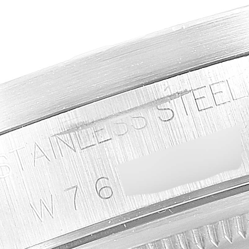 The image shows a close-up angle of the case side engraving on a Rolex Air-King 14010 Men's Stainless Steel White Dial 14010 Men's Stainless Steel White Dial watch, highlighting "STAINLESS STEEL" and part of the serial number.