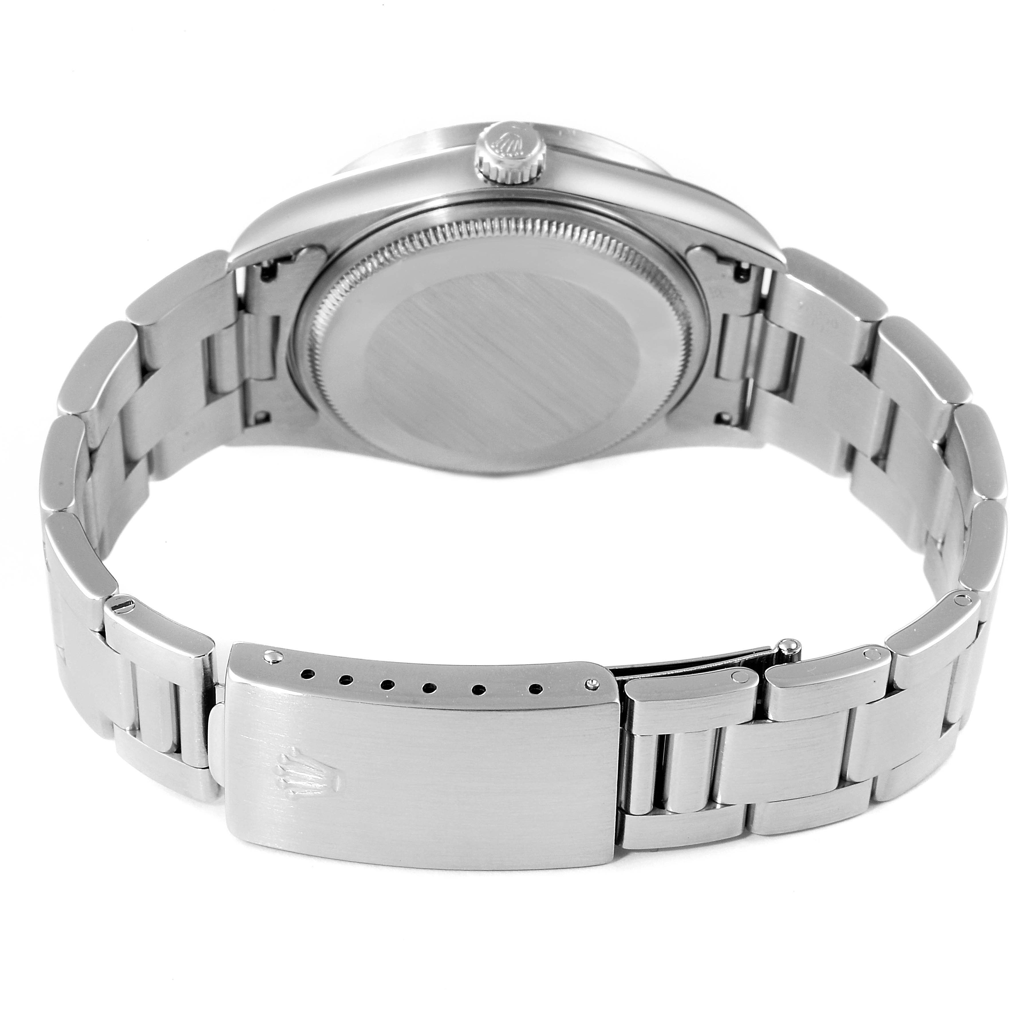 This image shows the back case and clasp of a Rolex Air-King 14010 Men's Stainless Steel White Dial 14010 Men's Stainless Steel White Dial watch from a rear angle.