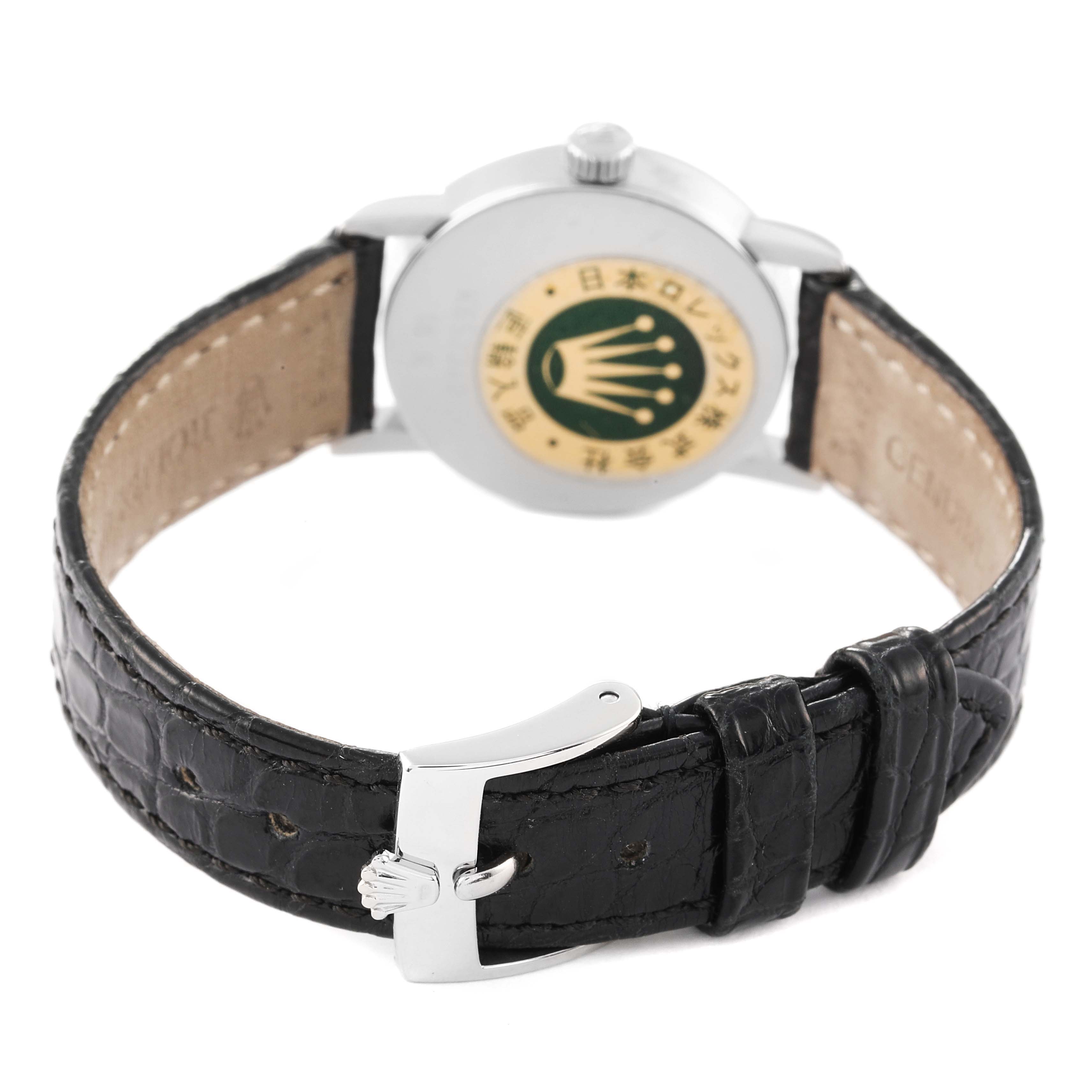 The image shows the back view of a Rolex Cellini 6110 Women's White Gold Silver Dial 6110 Women's White Gold Silver Dial watch, highlighting its leather strap, buckle, and case back.