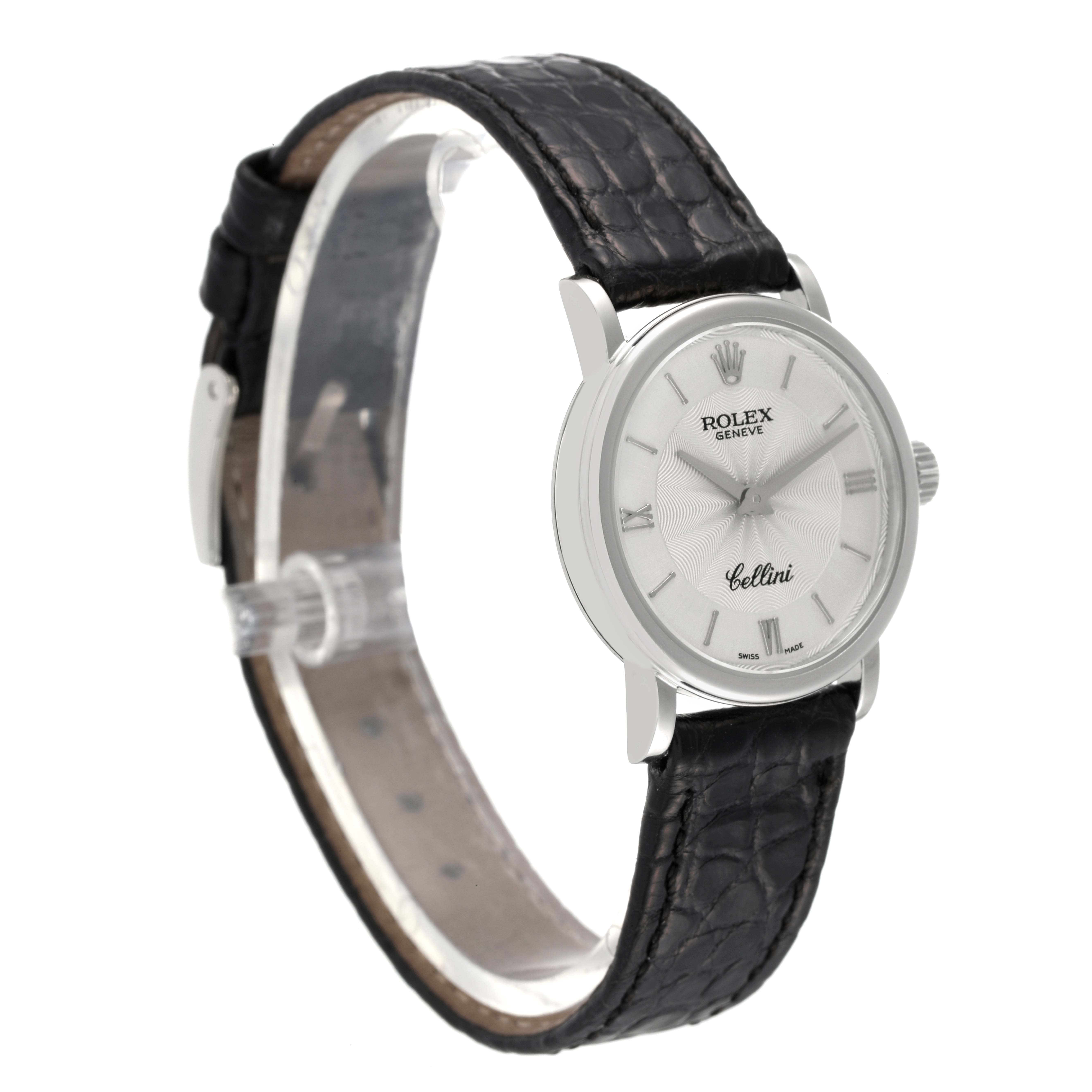 The image shows a Rolex Cellini 6110 Women's White Gold Silver Dial 6110 Women's White Gold Silver Dial watch at a three-quarter angle, highlighting the face, crown, and black leather strap.