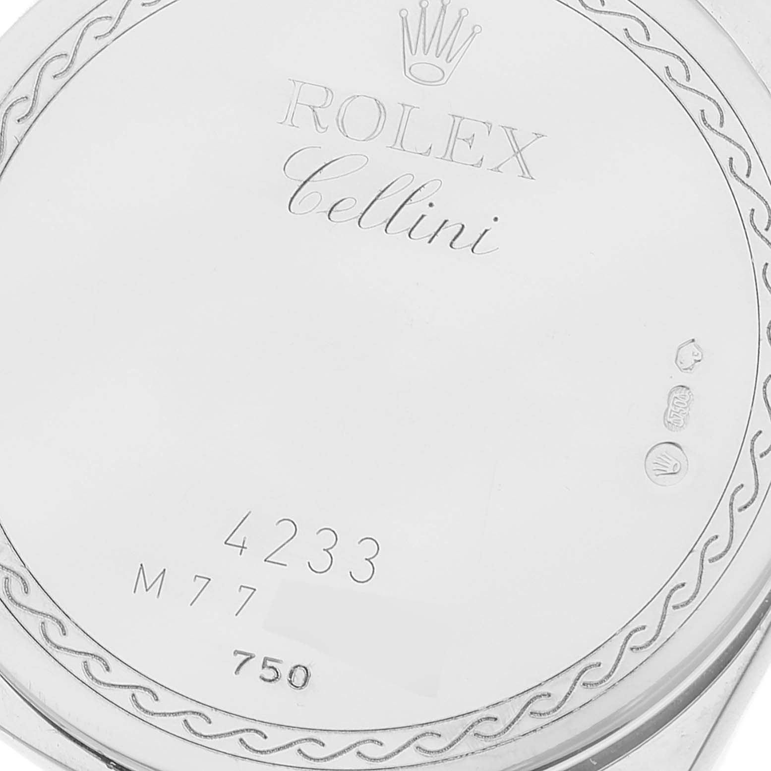 This image shows the back casing of a Rolex Cellini 4233 Men's White Gold White Dial 4233 Men's White Gold White Dial watch featuring branding, hallmark stamps, and model numbers.