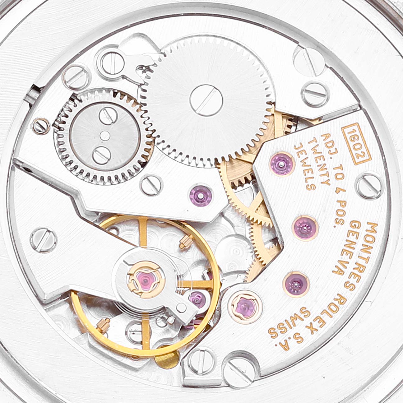 The image shows a close-up of the movement and internal components of a Rolex Cellini 4233 Men's White Gold White Dial 4233 Men's White Gold White Dial watch, highlighting gears and jewels.
