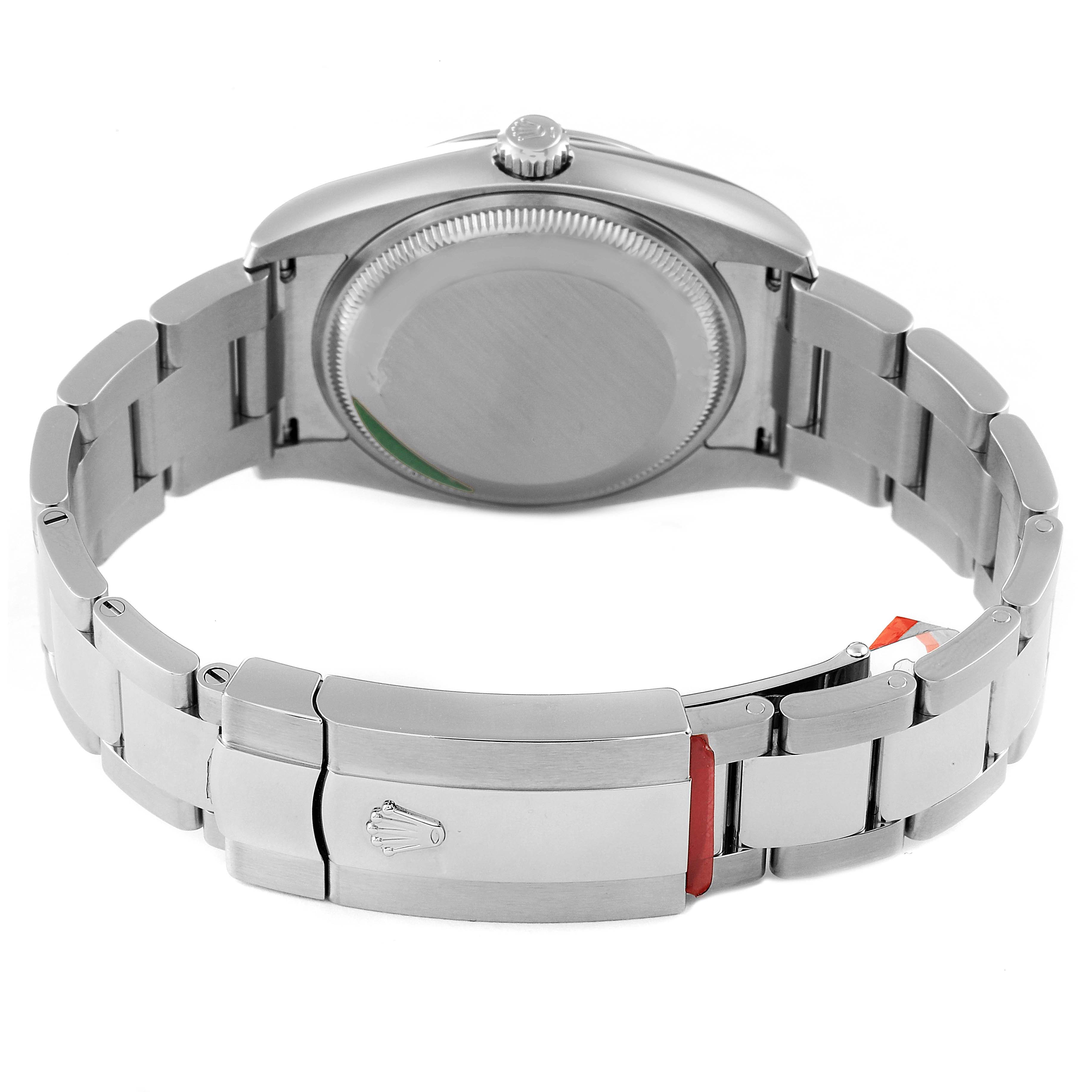 The image shows the back of a Rolex Date 115200 Men's Stainless Steel Pink Dial 115200 Men's Stainless Steel Pink Dial model watch, including its clasp and bracelet.