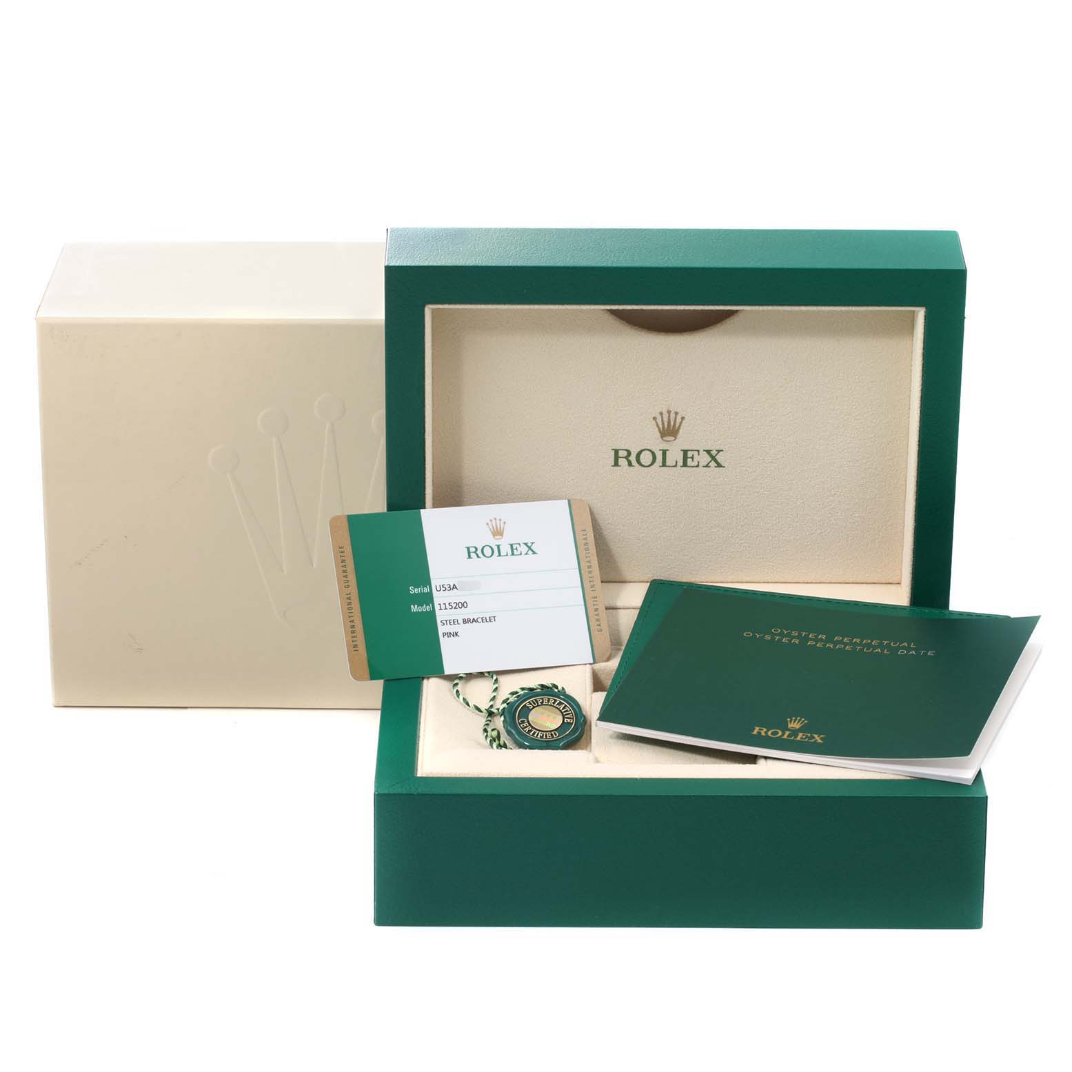 The image shows the packaging, warranty card, tags, and booklet for a Rolex Date 115200 Men's Stainless Steel Pink Dial 115200 Men's Stainless Steel Pink Dial model watch.